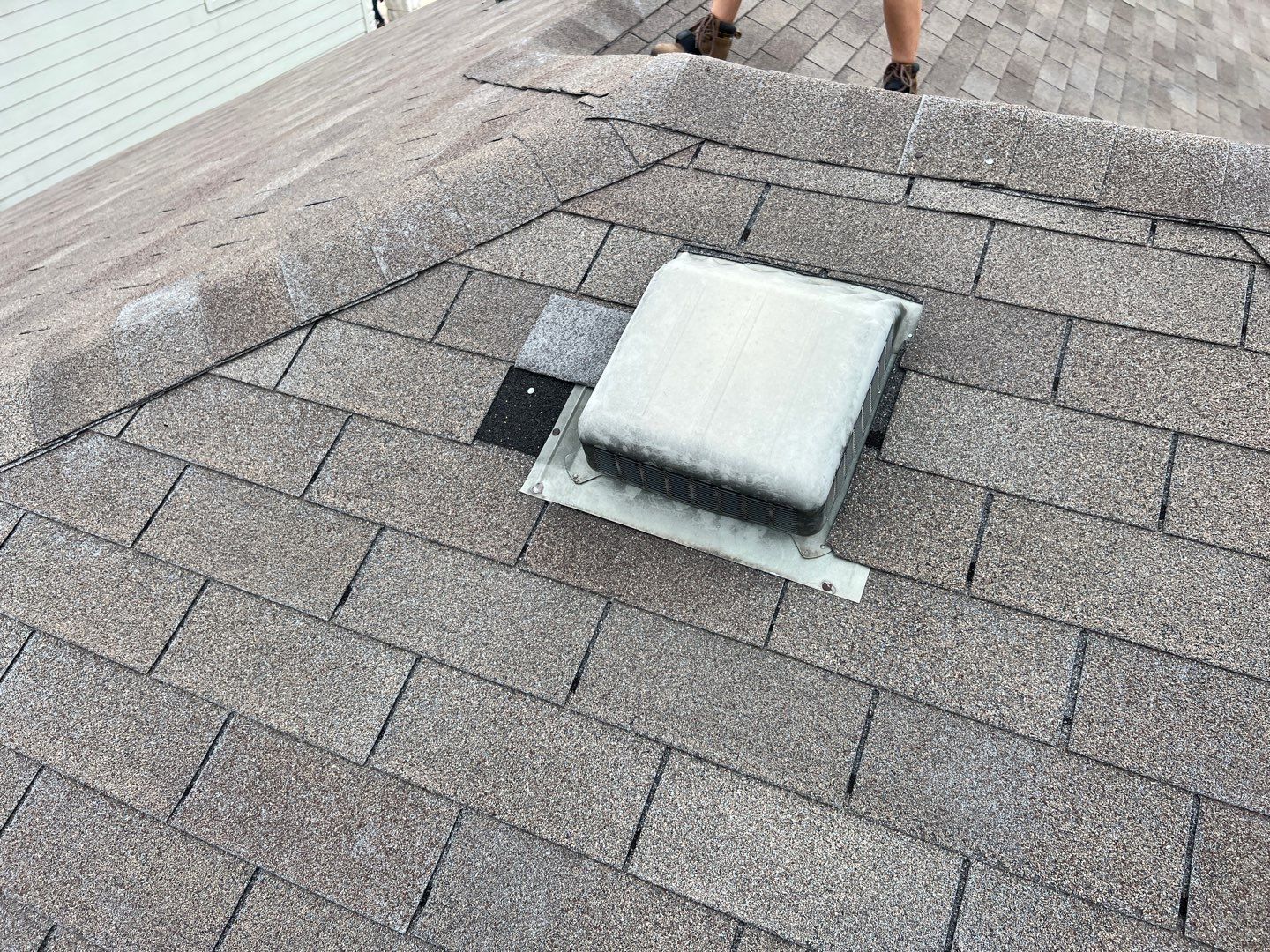 Wind damaged roof replacement by Oakwood Roofing and Construction, LLC