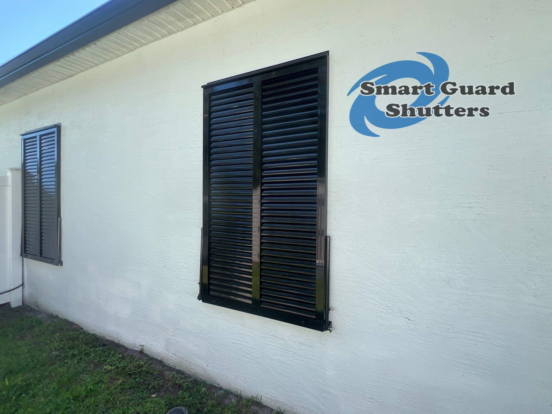Impact Bahama Shutters in Jet Black by Smart Guard Shutters