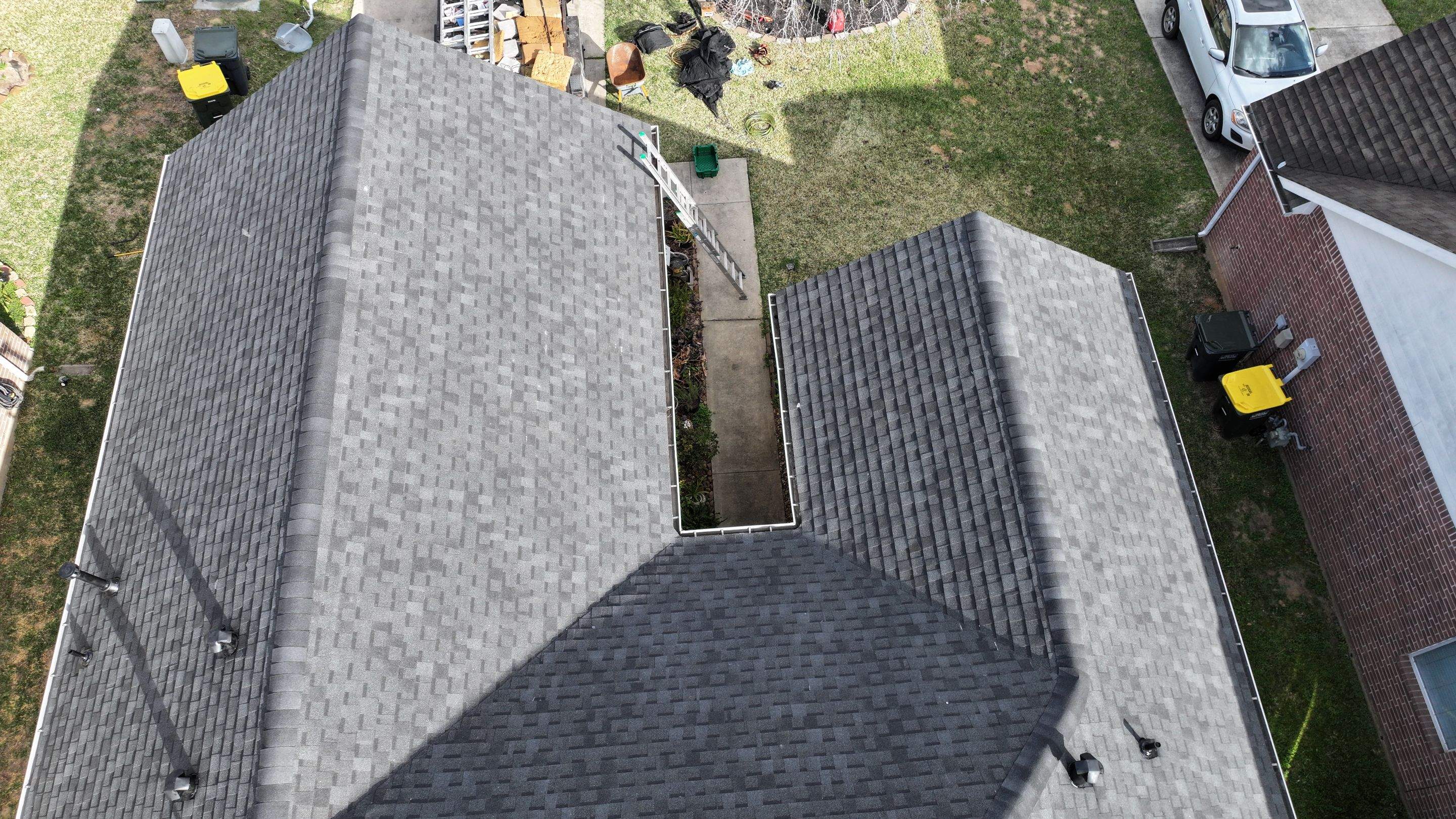 Full Roof Replacement on Brick Two-Story — Conroe, TX by PL Roofing & SB Roofing, LLC.