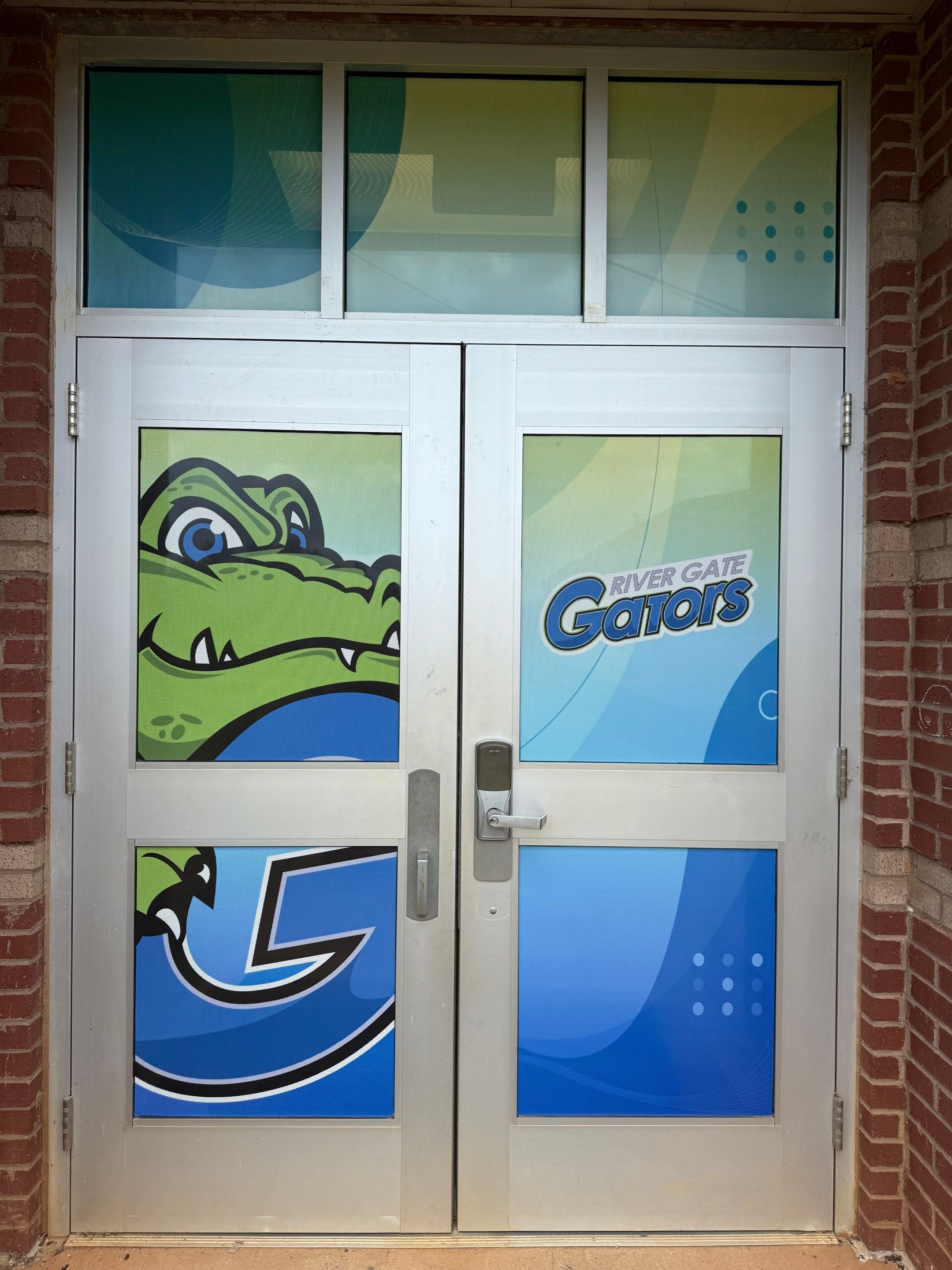 Rivergate Elementary - Window Safety Film Installation with Custom Graphics by QC Signs and Graphics