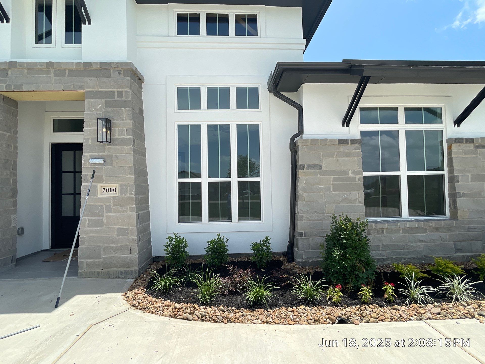 Waller Sophistication: Snowbound Color Stucco with Limestone Accents. by Apex Conventional Stucco Llc