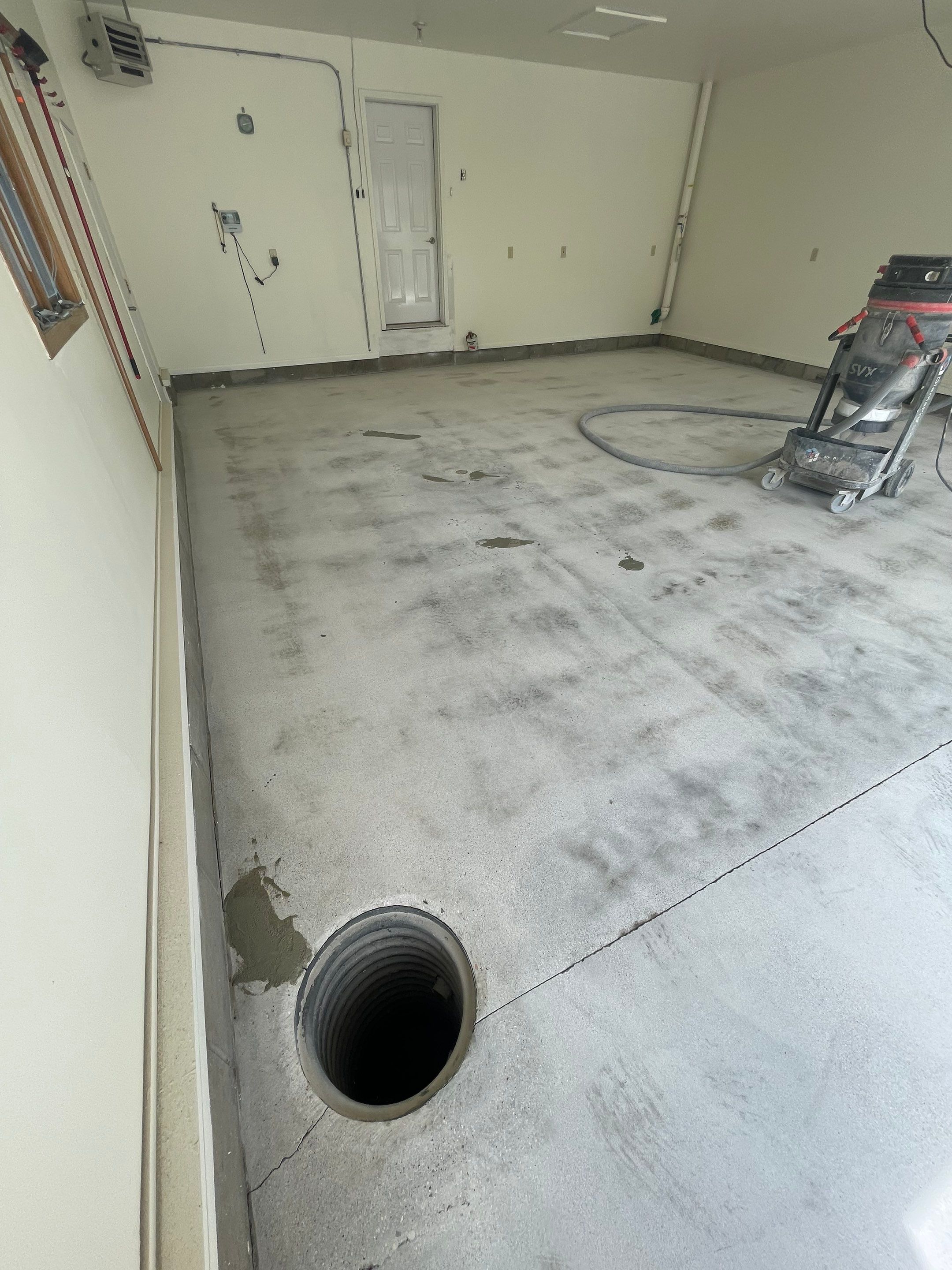 Madison Garage Concrete Coating with Feather Grey Speckle Finish by Select Painting, Coatings & Garage Cabinets
