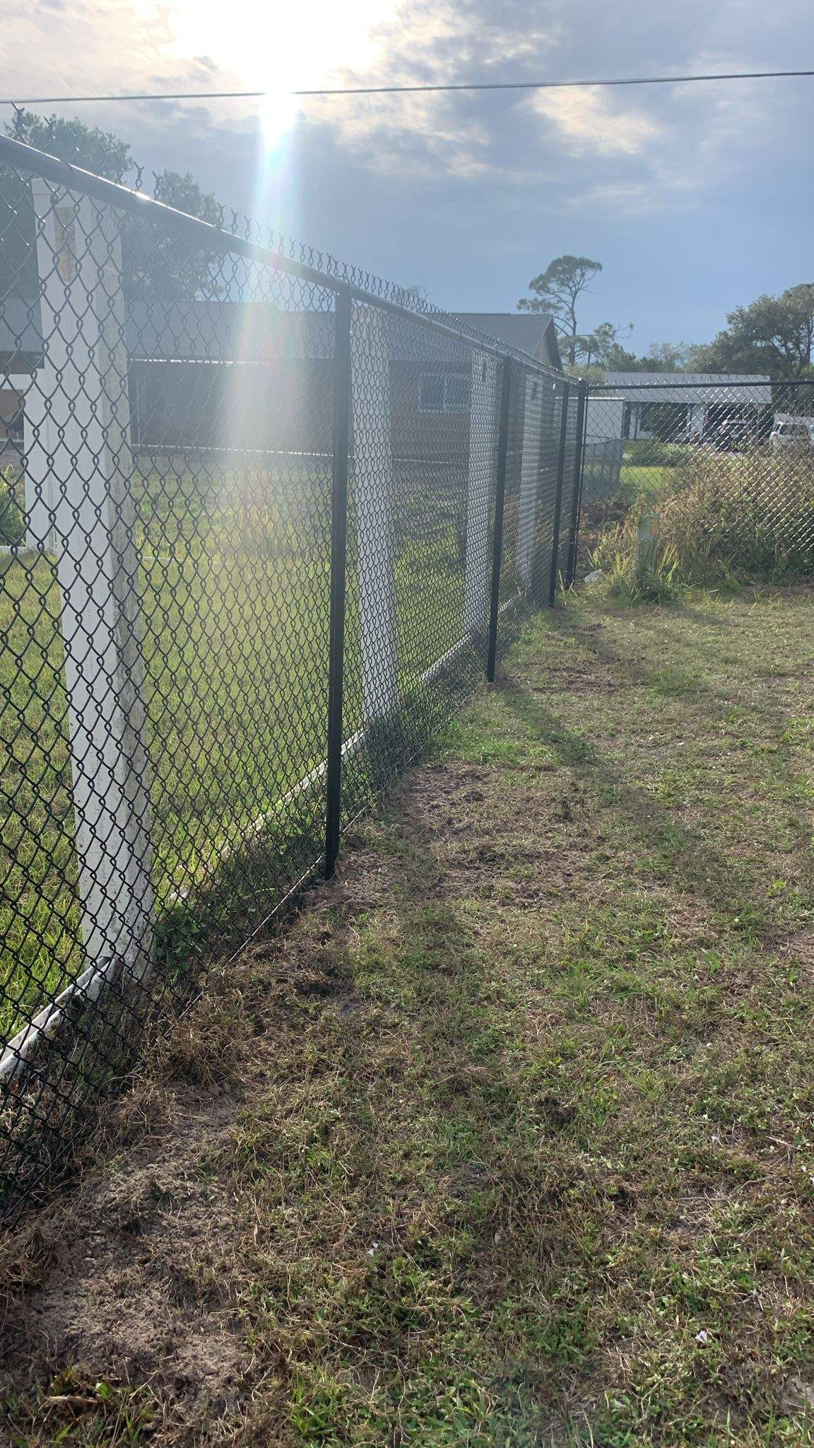 Black Vinyl-Coated Chain-Link Fence Installation in Port Charlotte by True Fence LLC