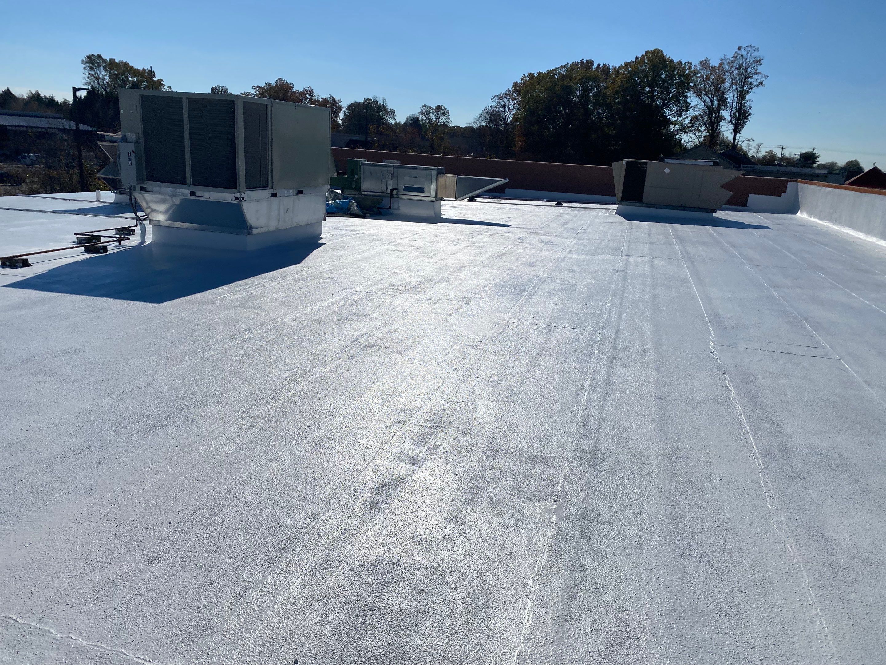 Commercial Coating using Poly Urerthane and Silicone Coating by Just In Time Roofing and Restoration