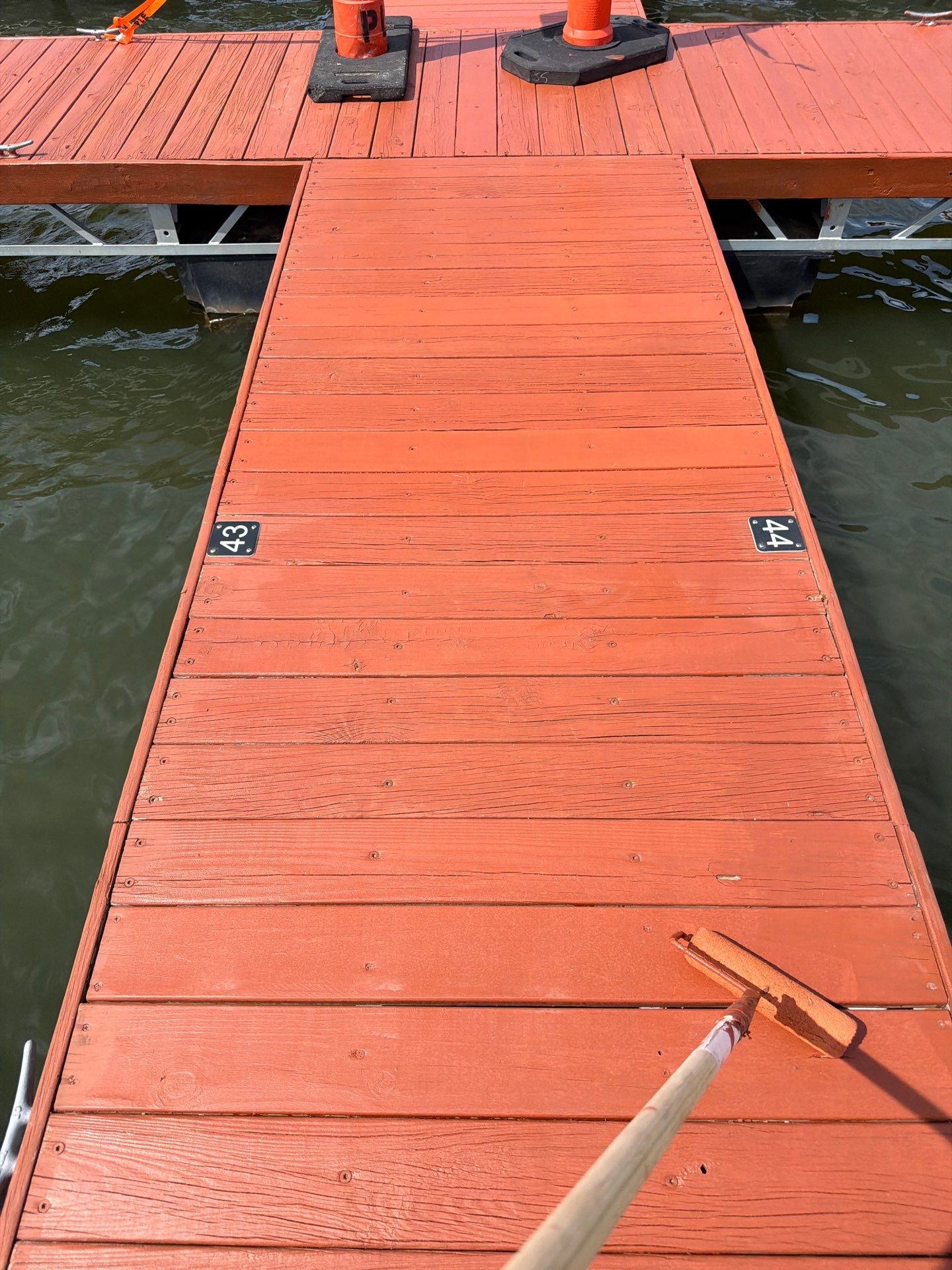 Floating Boat Dock Board Replacement and Staining in New Florence by Acute Roofing And Exteriors