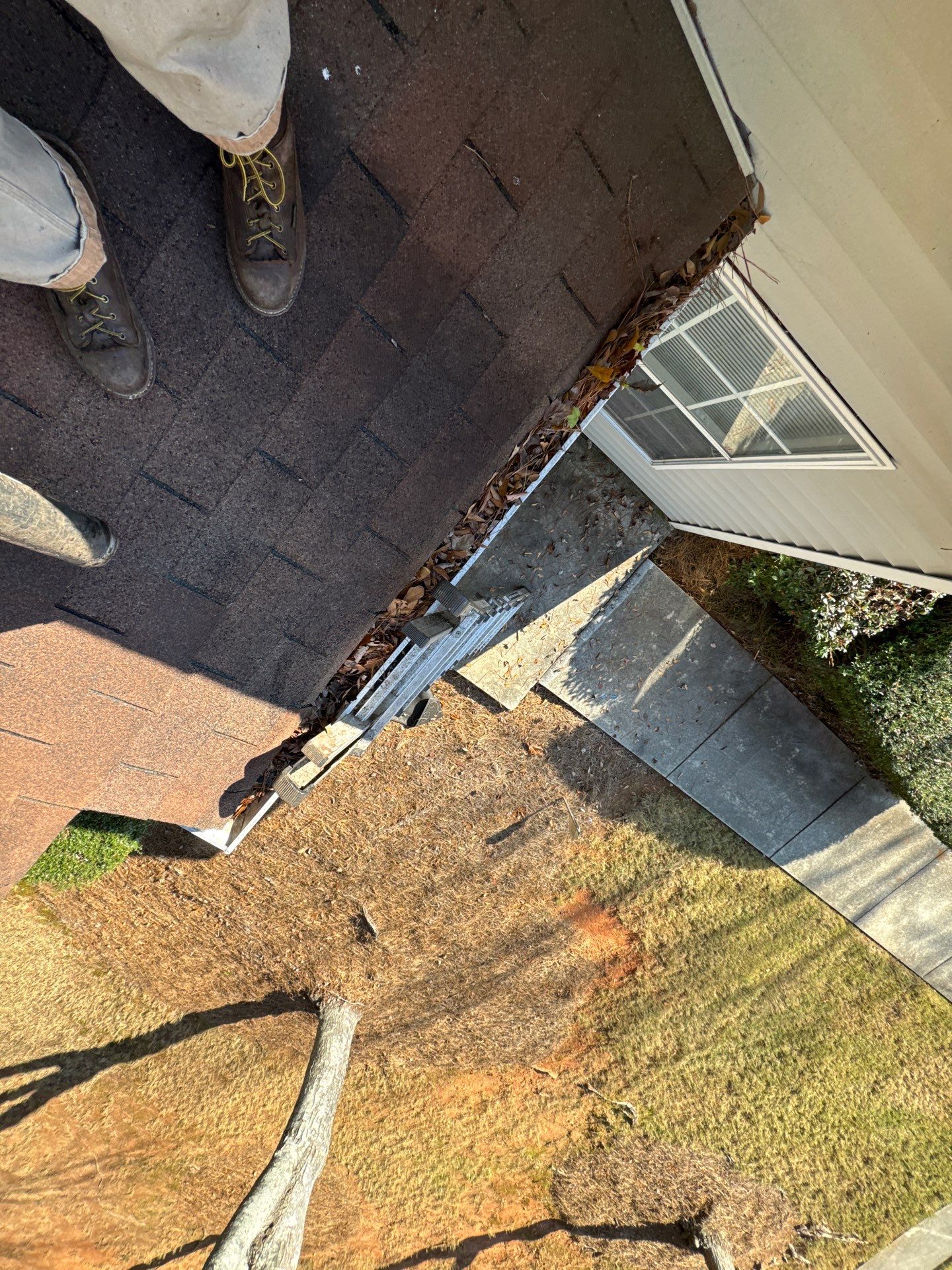 Commercial gutter cleaning Covington & Newton County, GA before photo with filled gutters