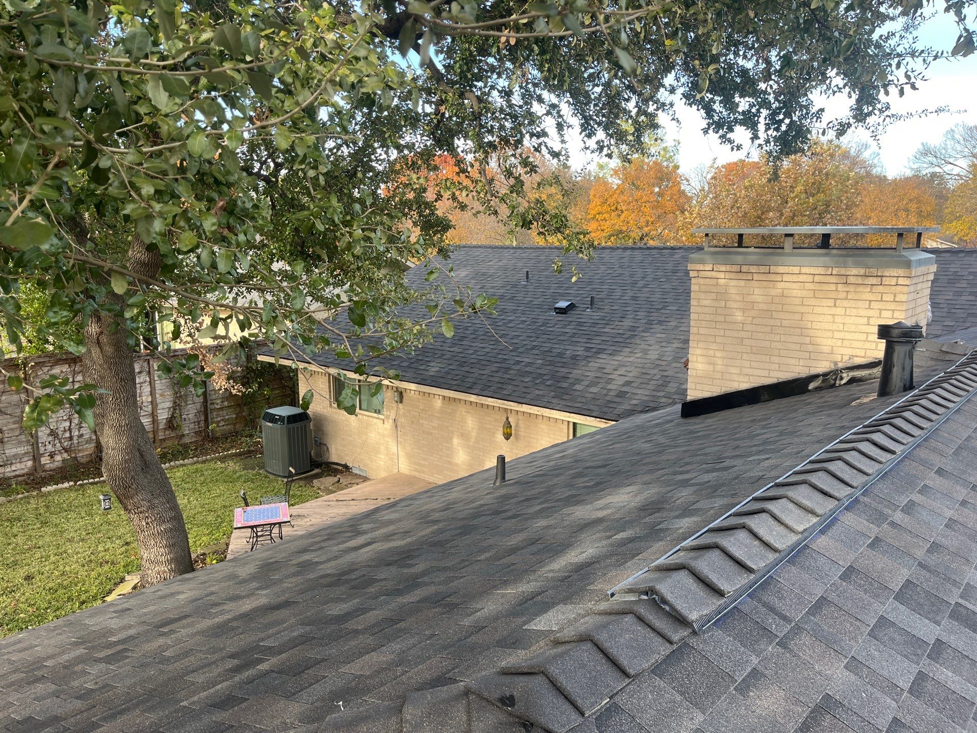IKO Brownstone- White Brick  by Tejas Roofworks + Restoration