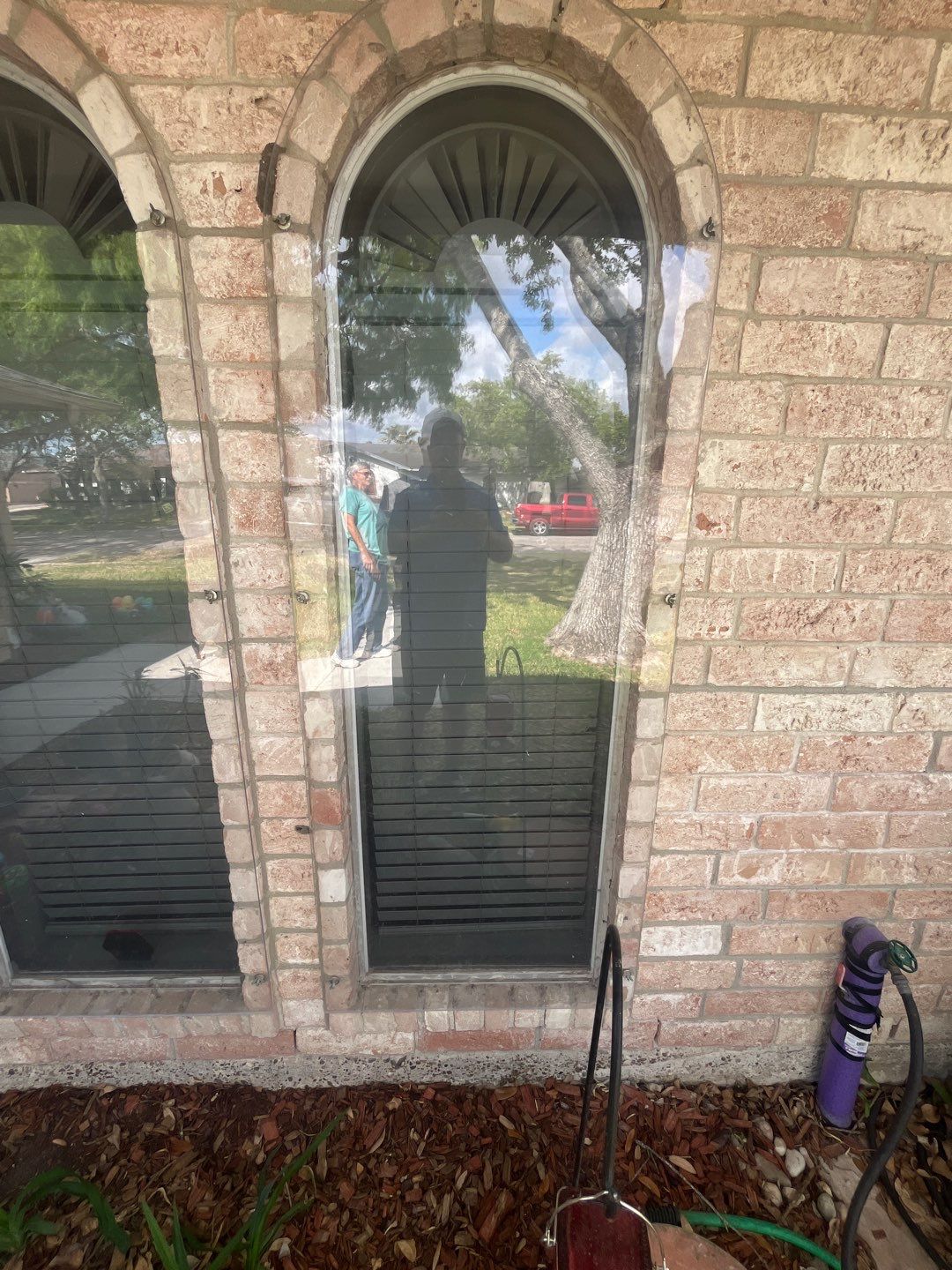 Colored Vinyl Windows to blend into brick by Bayfront Roofing and Construction