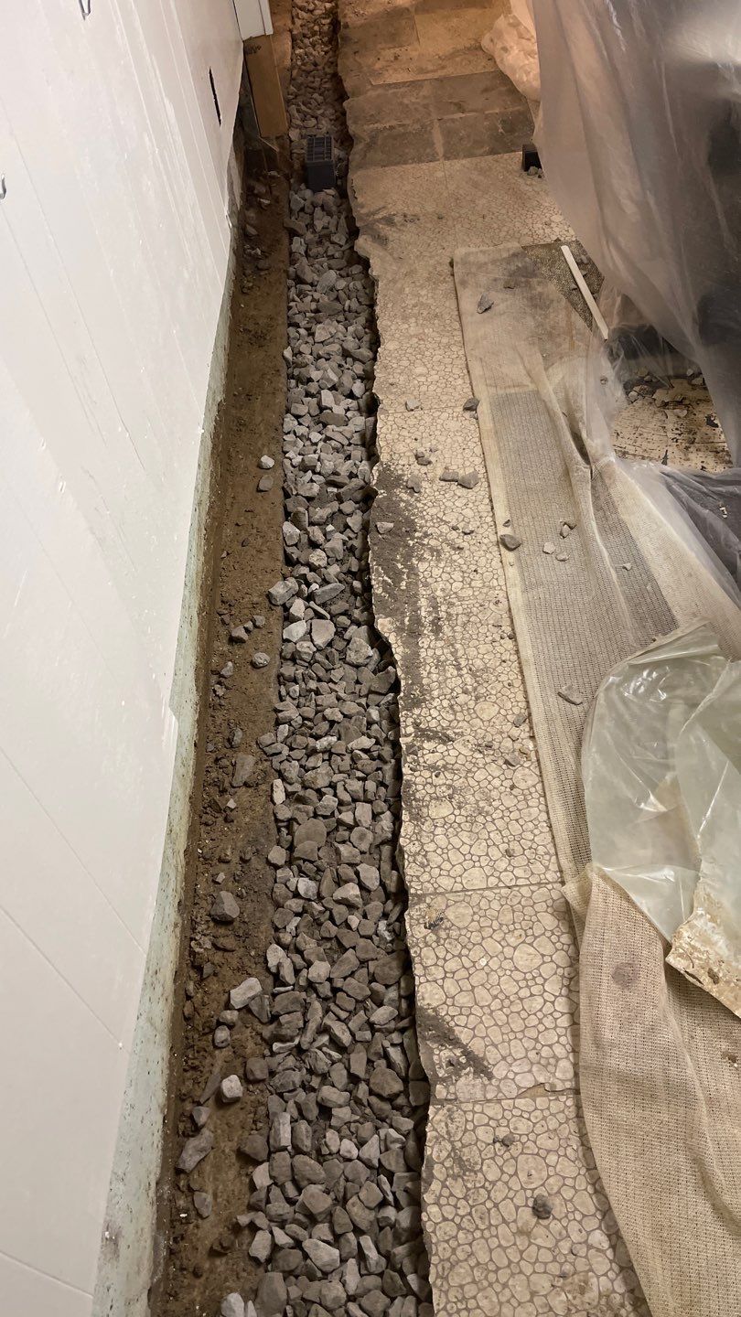 Interior Waterproofing Using GrateDrain™ Products by Toledo Basement Repair