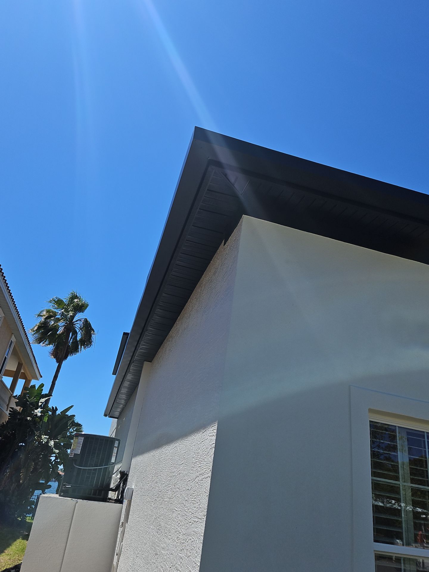 Soffit and Fascia Installation and black seamless gutters in Sarasota FL by Gutter Professors
