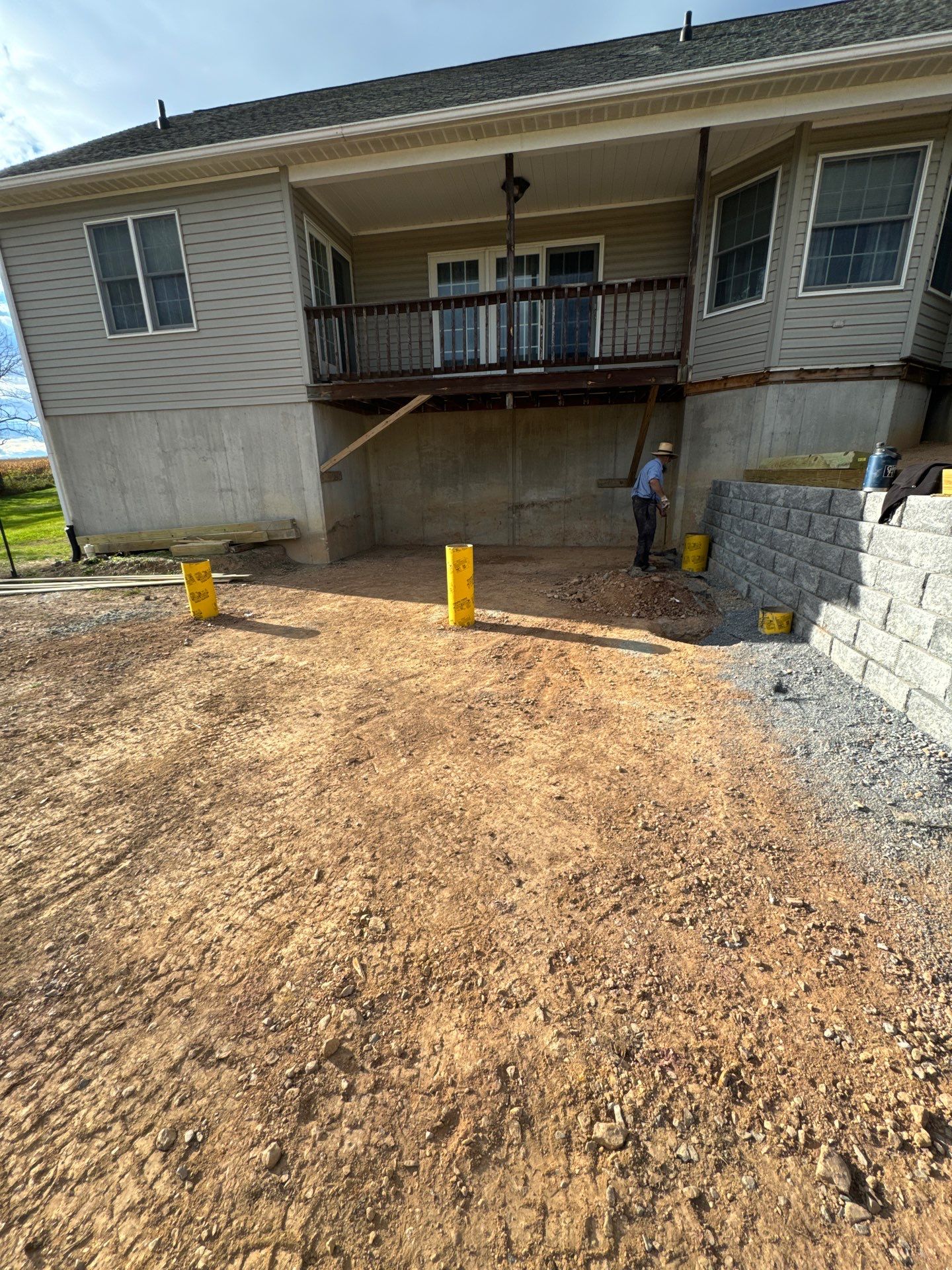 Green Metal Roof and Custom Covered Deck in Duncannon by Esh Builders