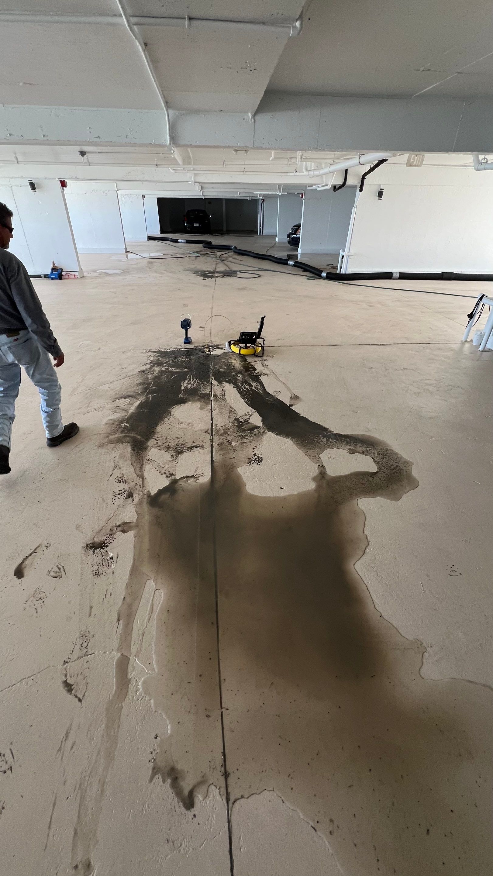 Isles of Capri Condo Parking Garage Drainage System Cleaning by APS Power & Water
