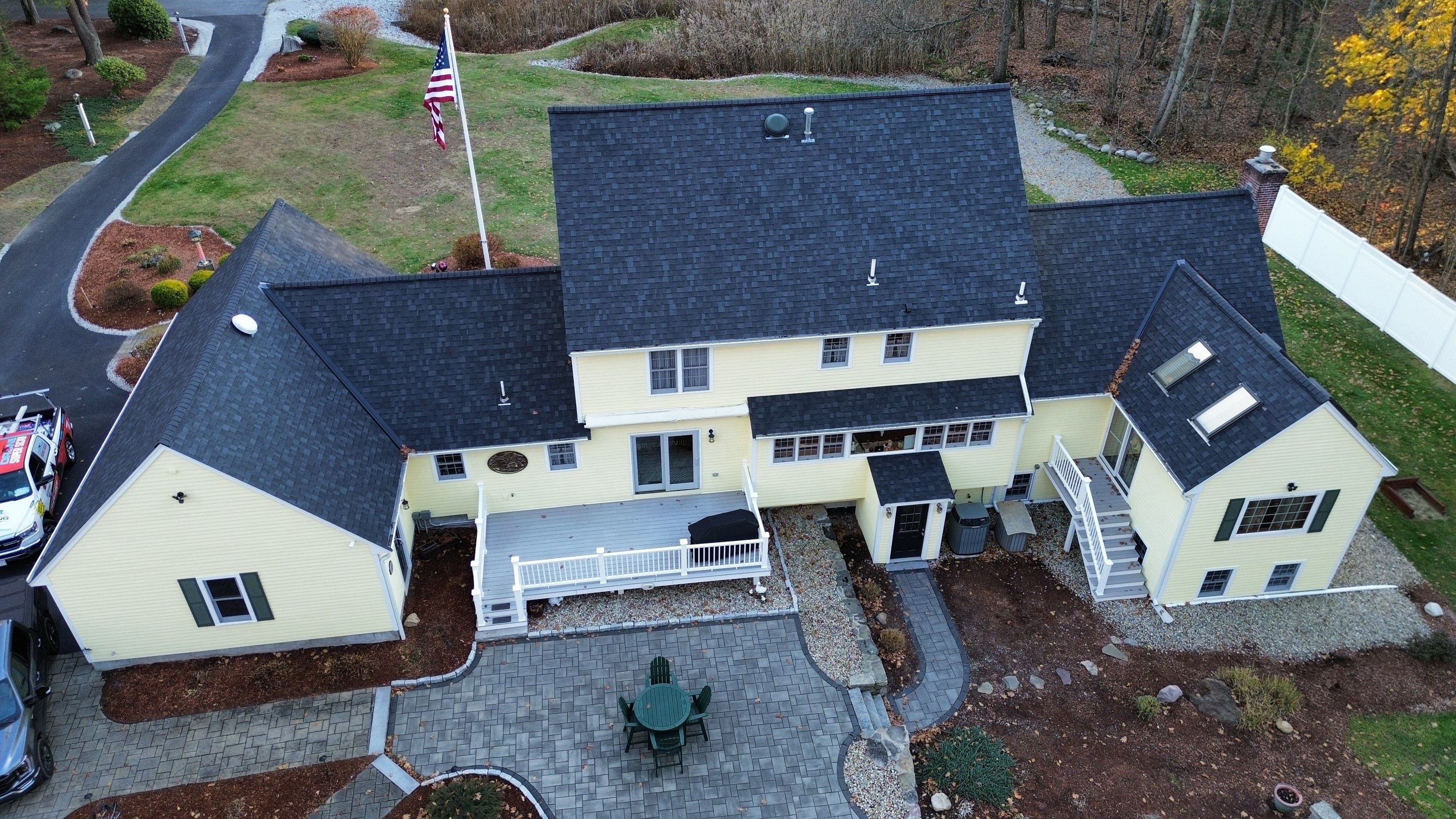 Chelmsford Premium Roof: Onyx Black Shingles with Standing Seam Metal Porch by Mighty Dog Roofing of Greater Middlesex County
