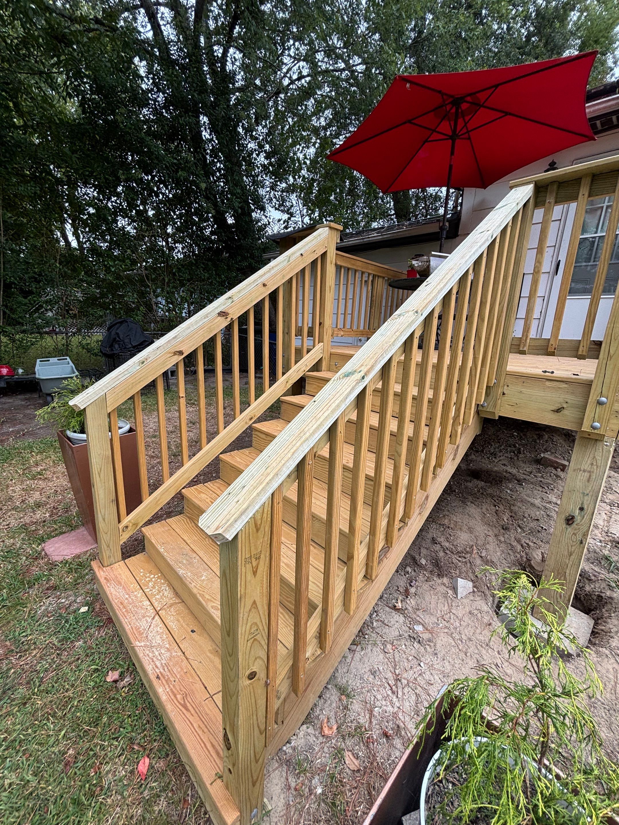 Custom Pressure-Treated Wood Deck and Staircase Construction in Raleigh by The Remodeling Company