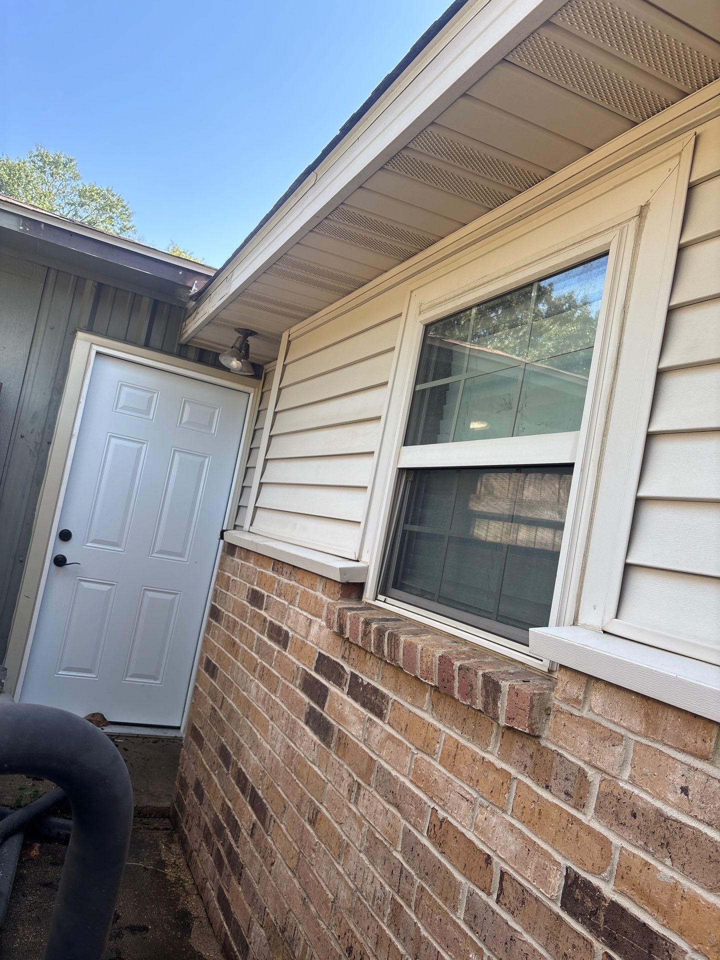 Exterior Painting in Flint, TX | White Brick Home & Metal Building with Sherwin-Williams Duration by Quality Coats Painting