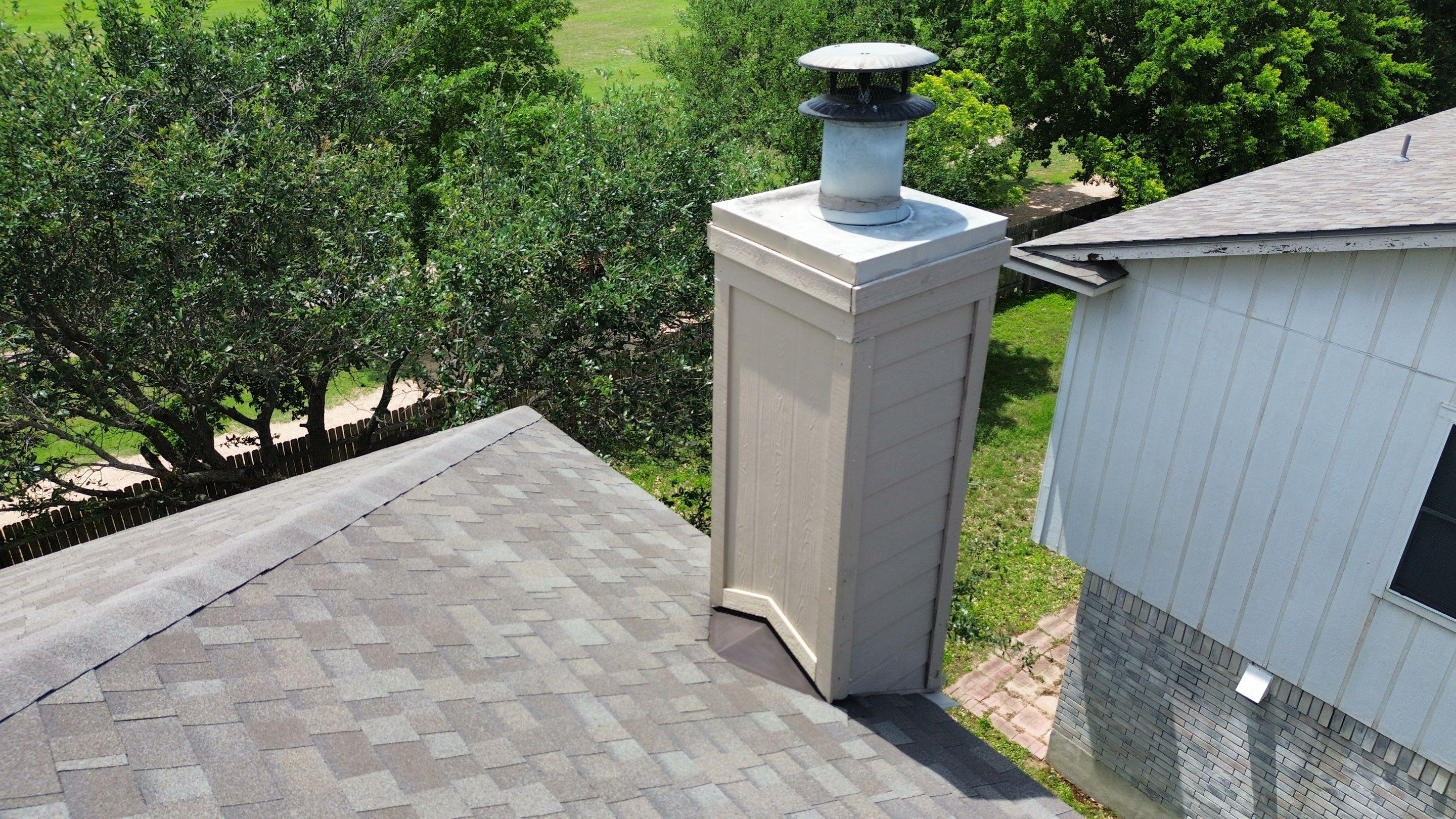 Roof Replacement & Chimney Cricket Upgrade in Cedar Park, TX by Kstylez Roofing & Construction