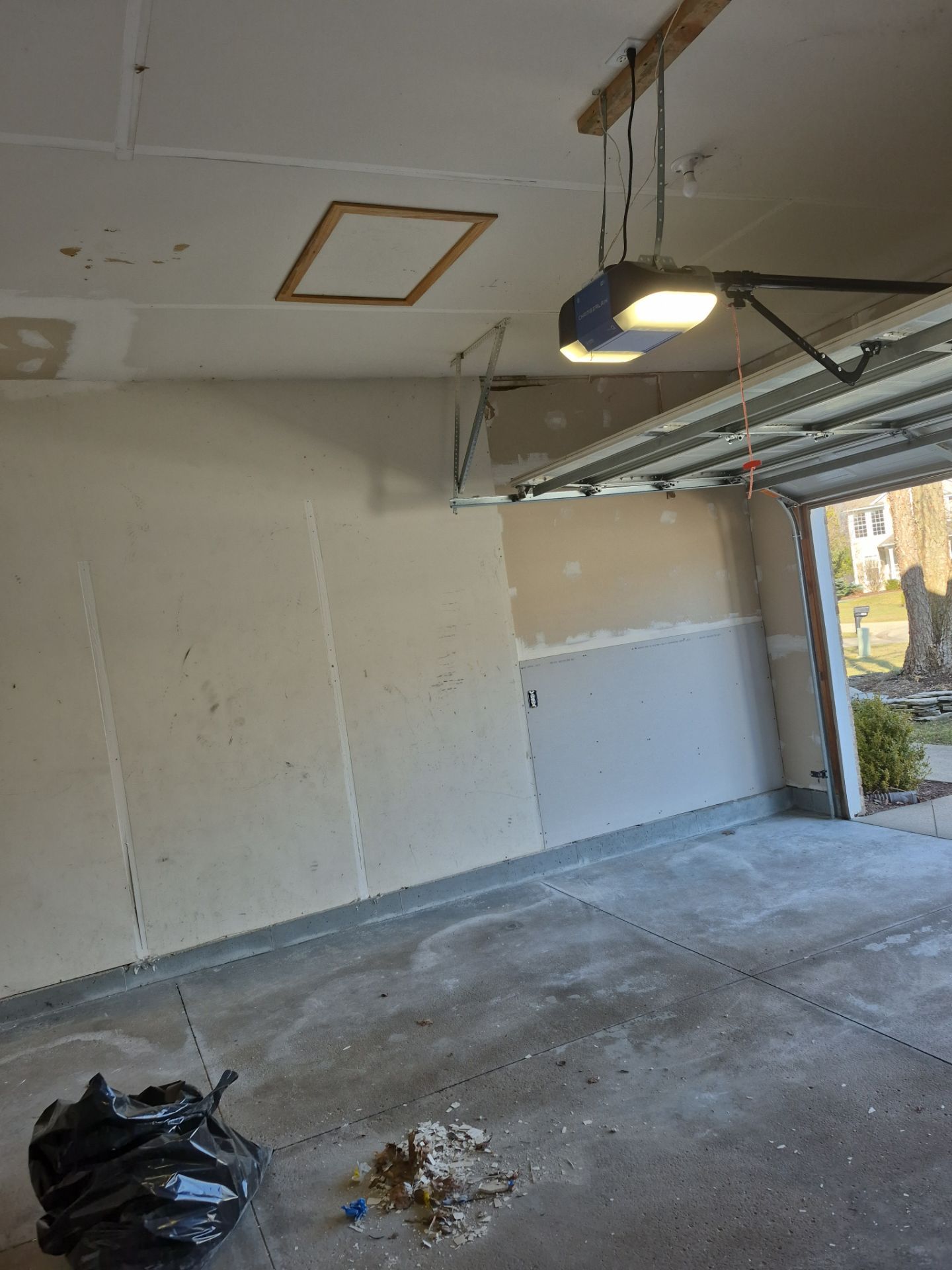 Custom Epoxy Flake Floor and Garage Wall Renovation in Ada by Gordon Painting