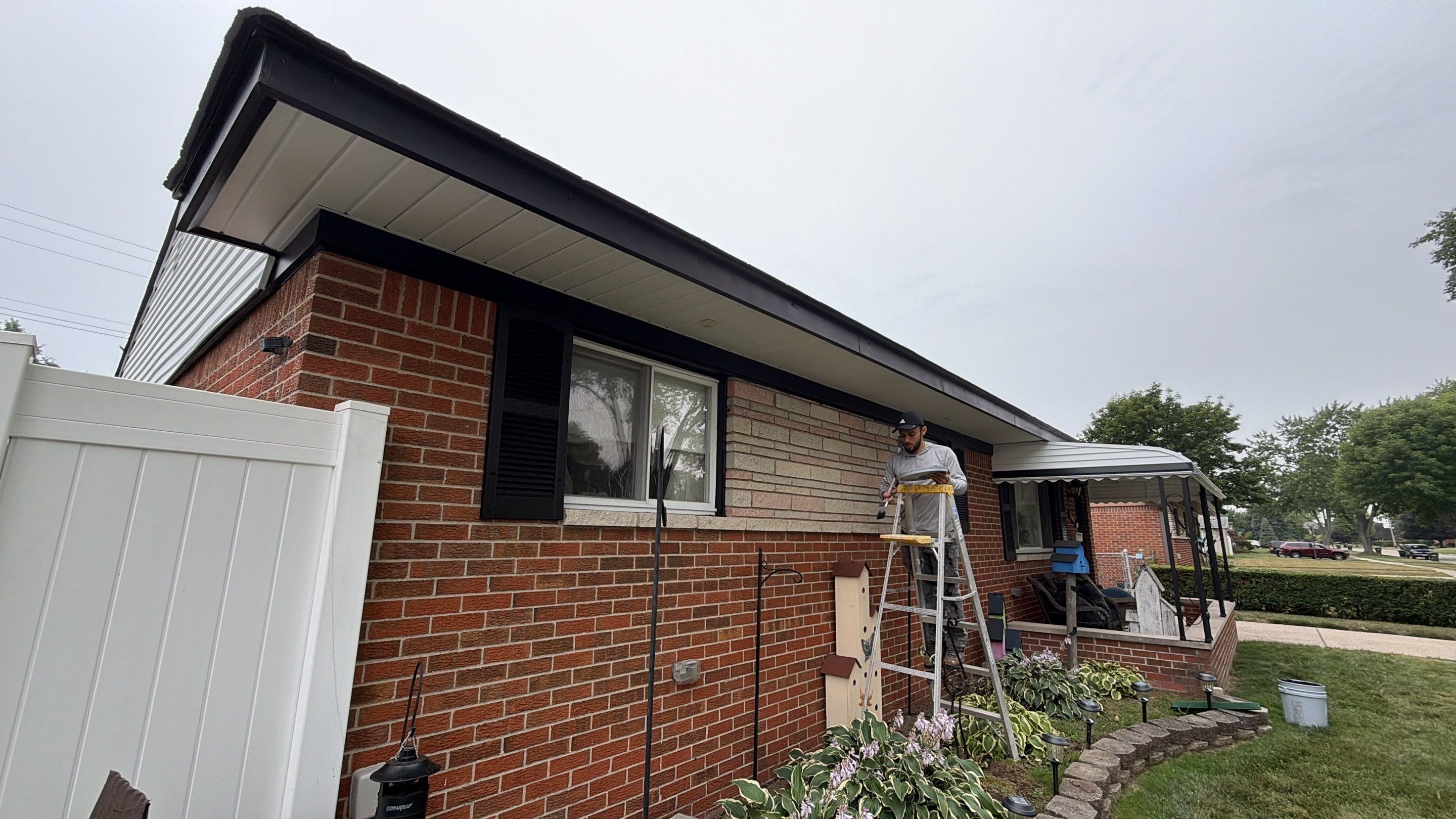White Vinyl Siding and Gutter Installation in Sterling Heights by Top Shelf Painter