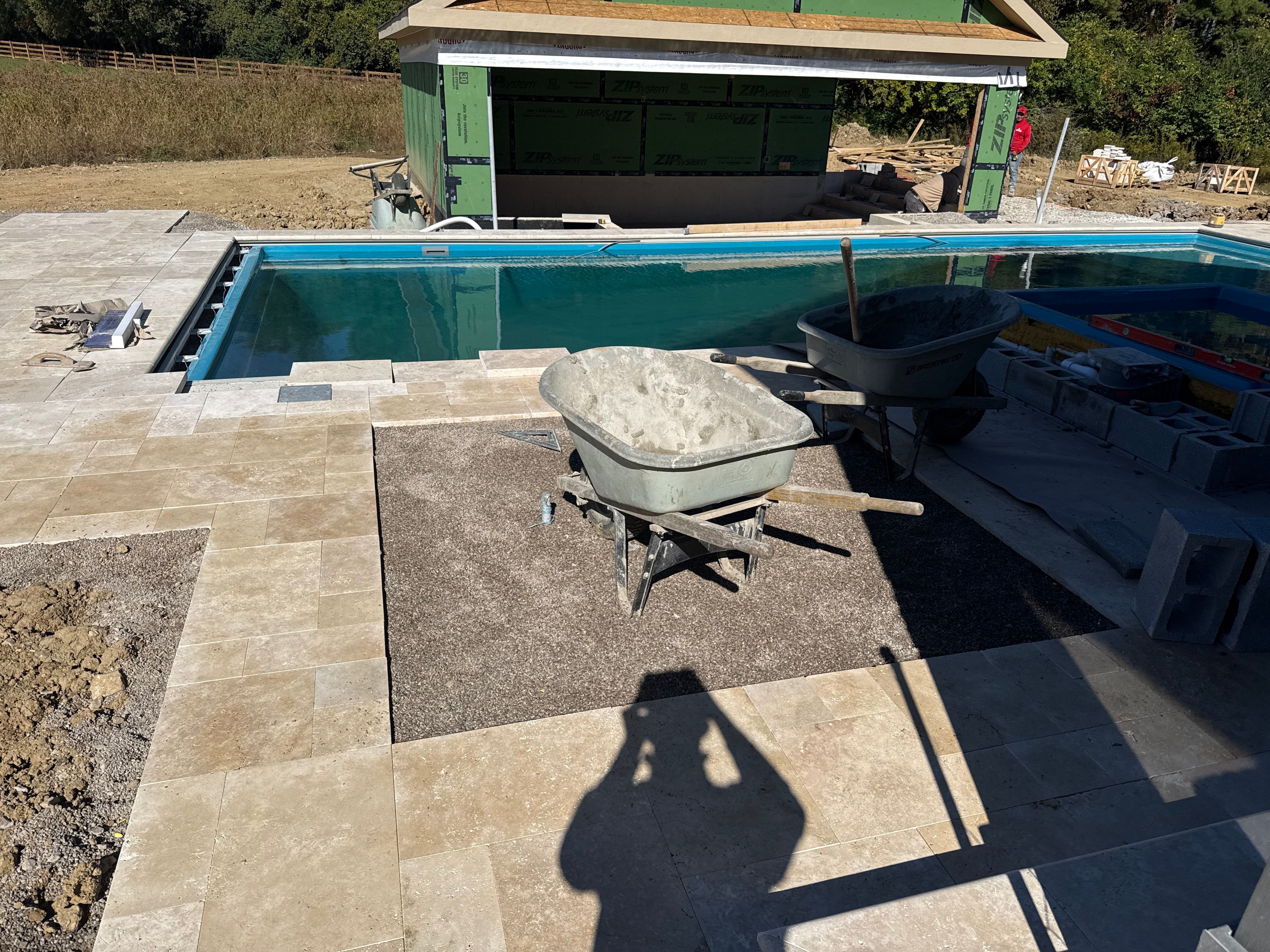 Custom Travertine Pool Deck with Artificial Turf Insets in Delaware by Southwest Greens Midwest
