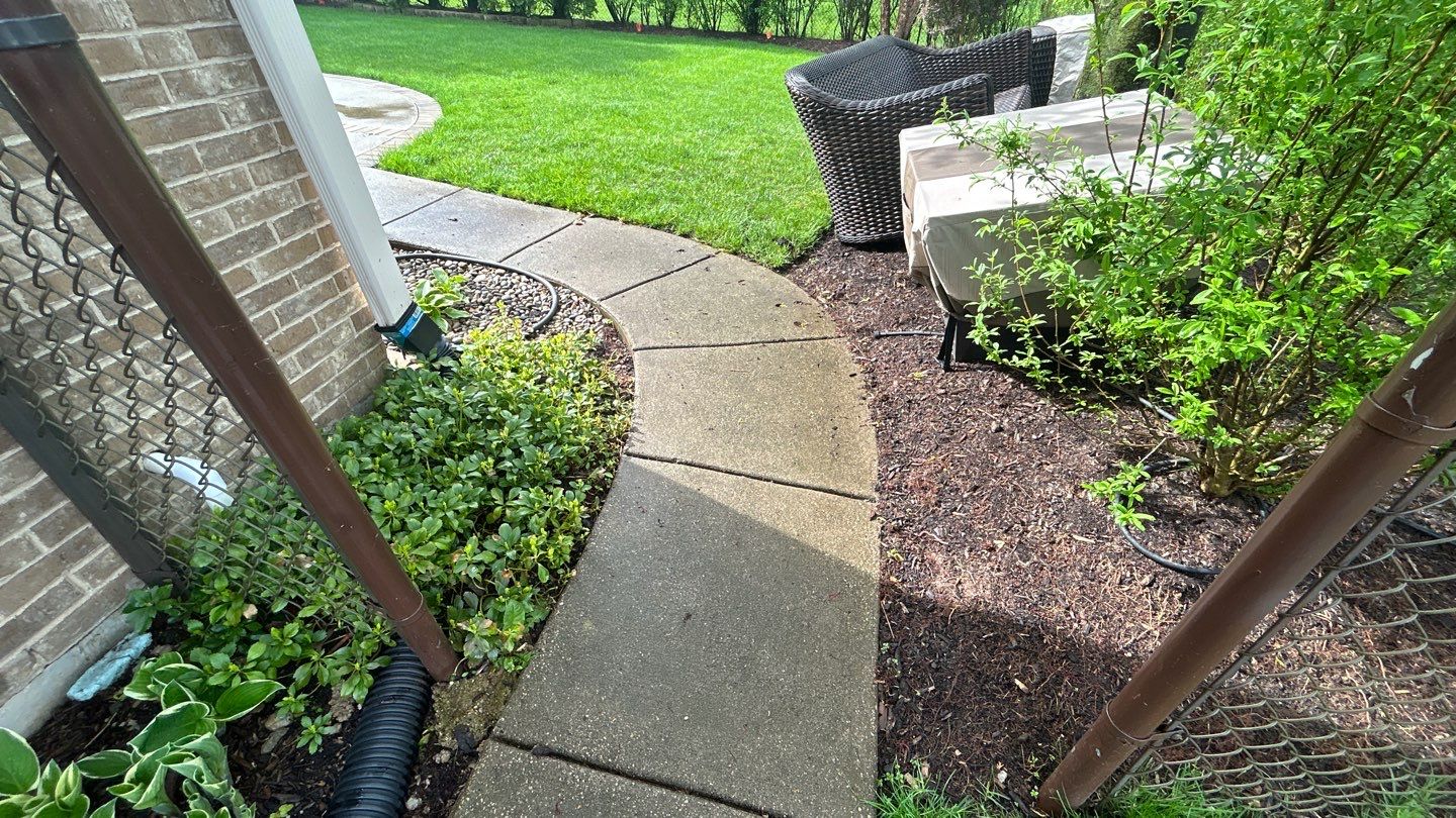 concrete patio and driveway cleaning by Northern Power Washing LLC.