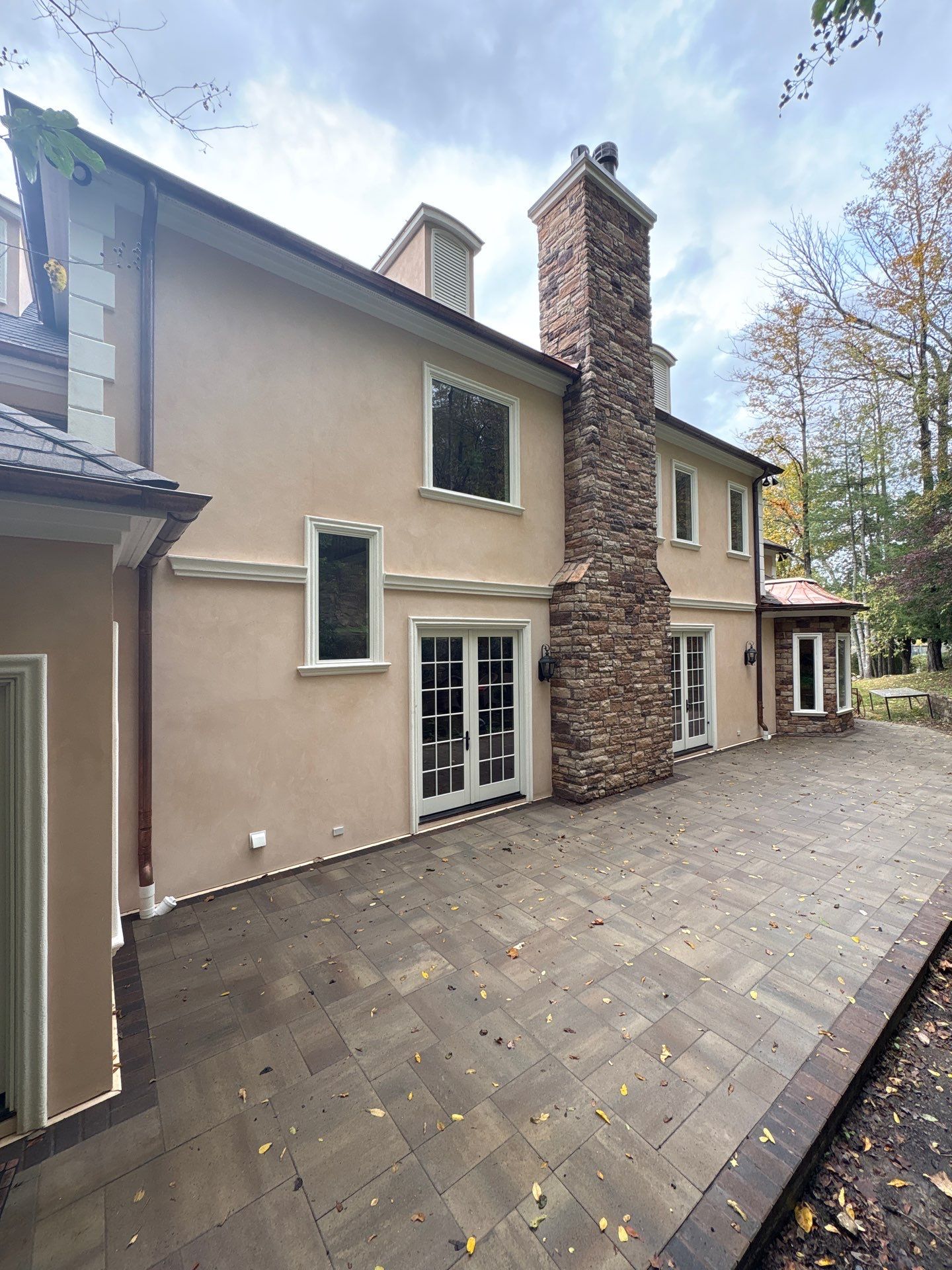 Franklin Exterior Remodel Featuring Custom Stucco and Stone Hardscaping by U.S. Exterior Solutions