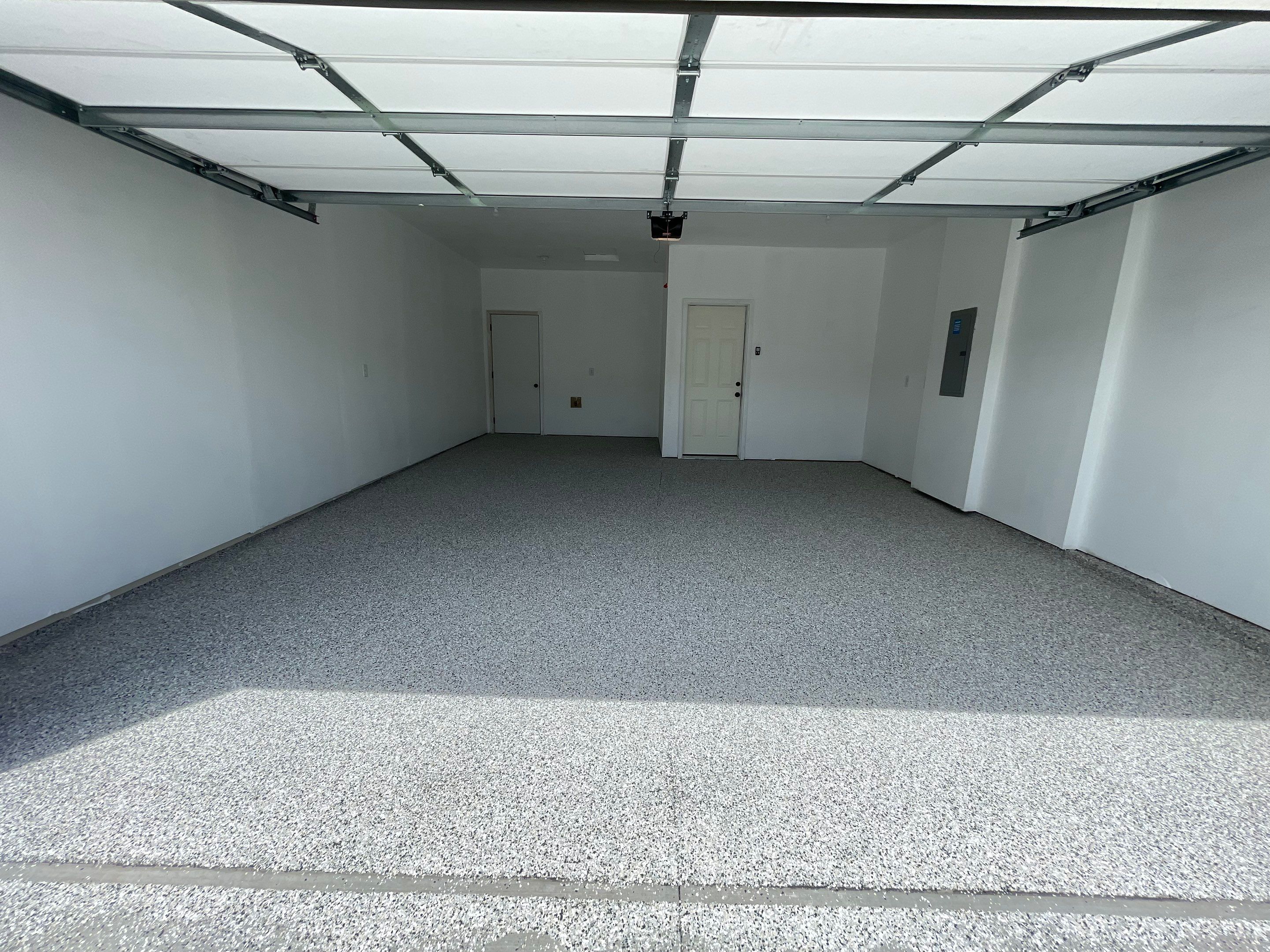 Sioux Falls Garage Floor Transformation with Cabin Fever Decorative Chips by Select Painting, Coatings & Garage Cabinets