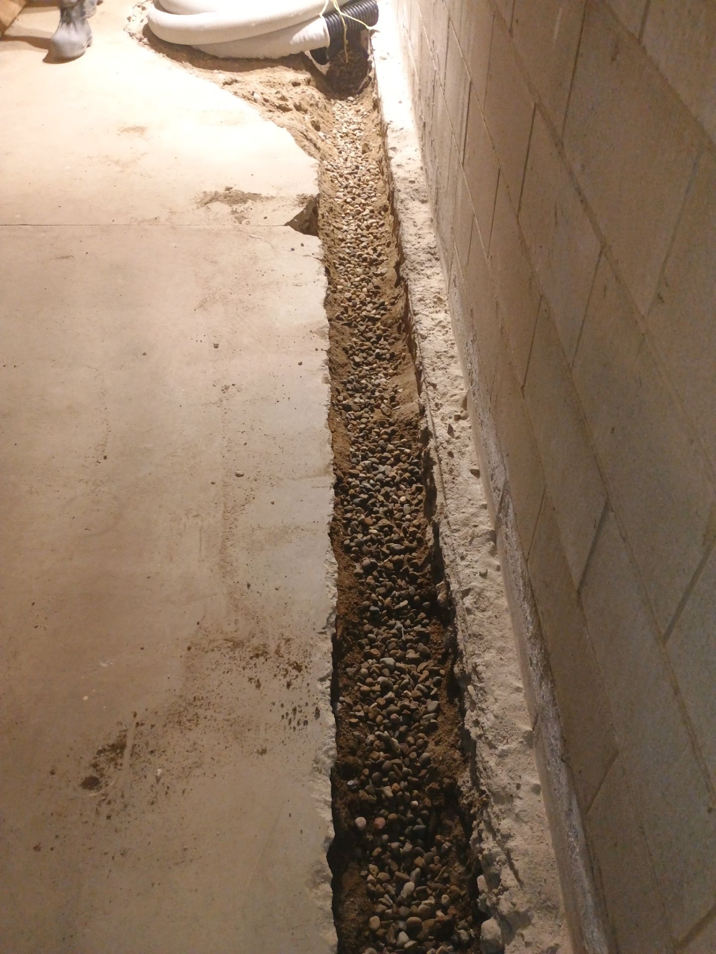 Interior Drain Tile & Buried Discharge in South Minneapolis by Waterproofing Northeast