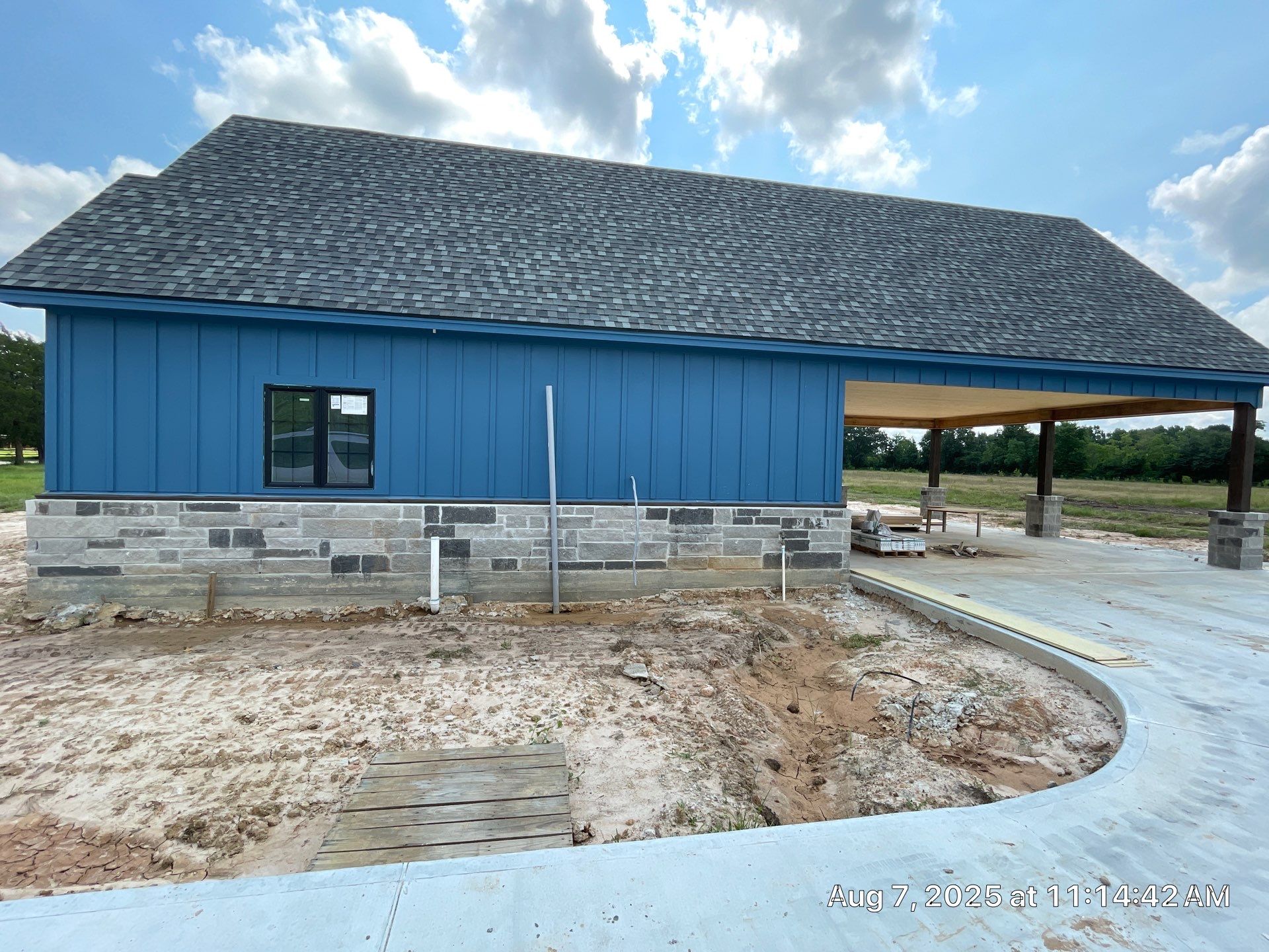 Natural Stone Elegance: Apex Installation Accented by Blue Siding by Apex Conventional Stucco Llc