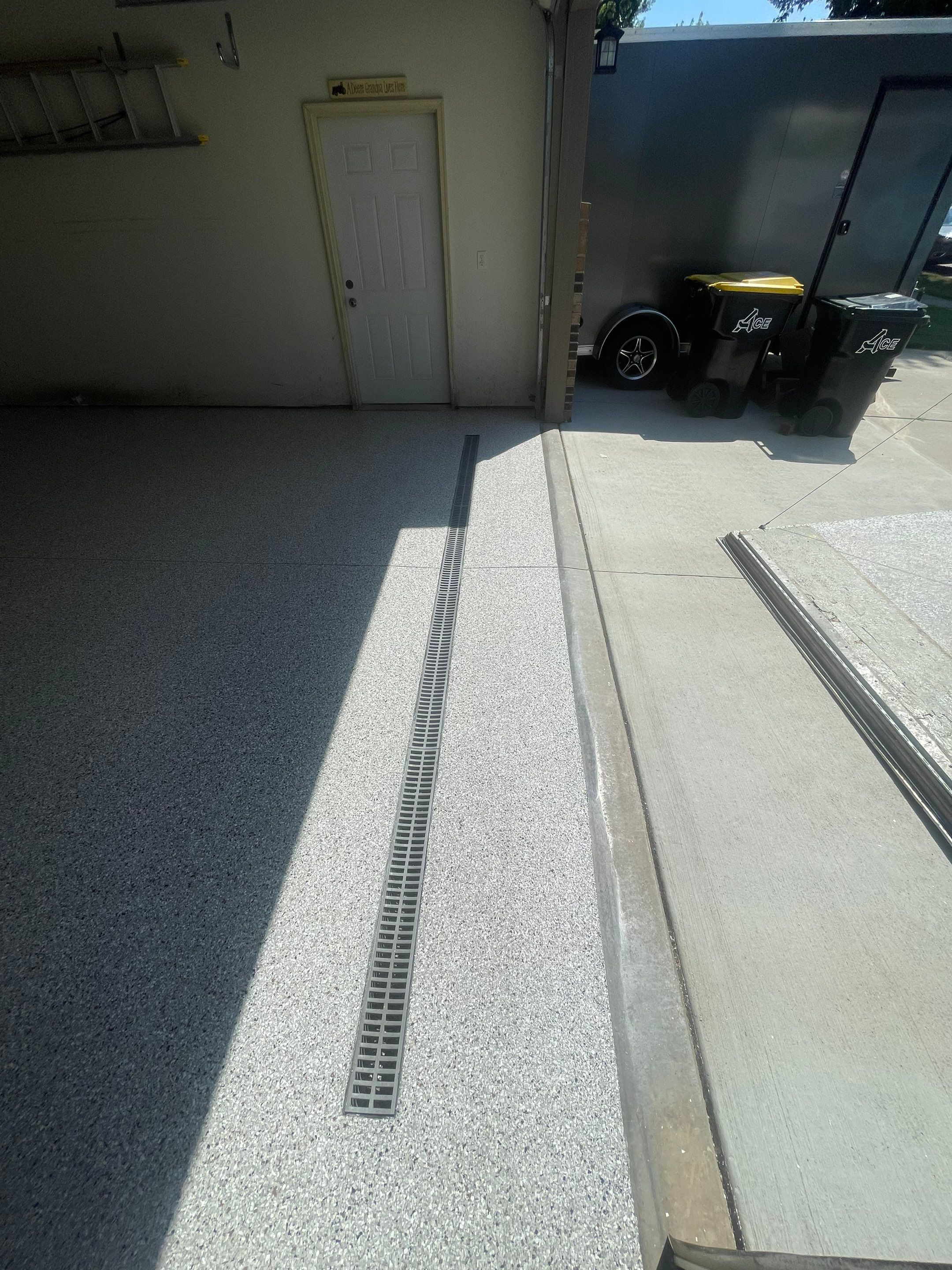 Multi-Stall Garage Floor Coating Installation in Sioux Falls by Select Painting, Coatings & Garage Cabinets