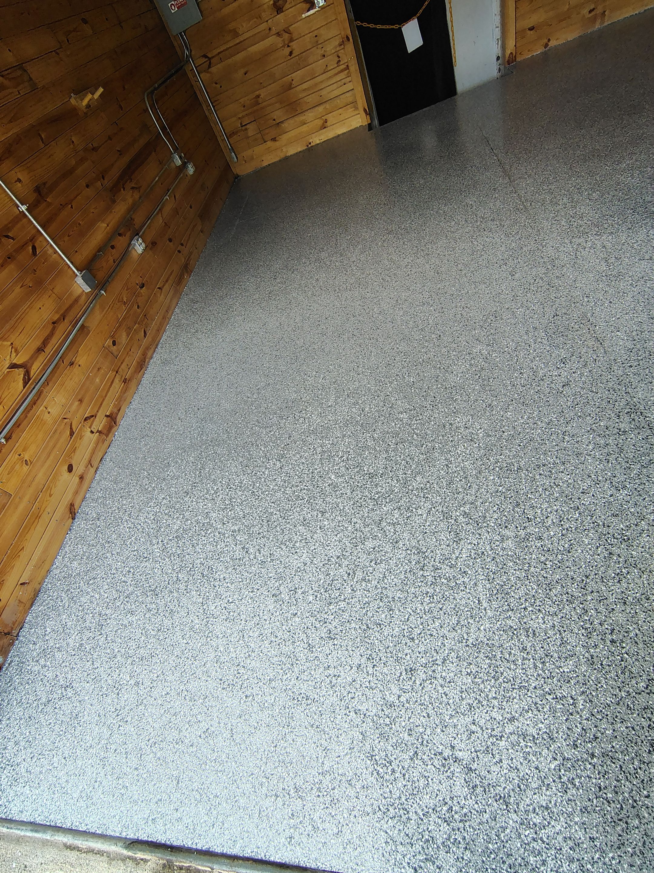 Commercial Epoxy Flake Floor Coating in Emmetsburg, Iowa by Select Painting, Coatings & Garage Cabinets