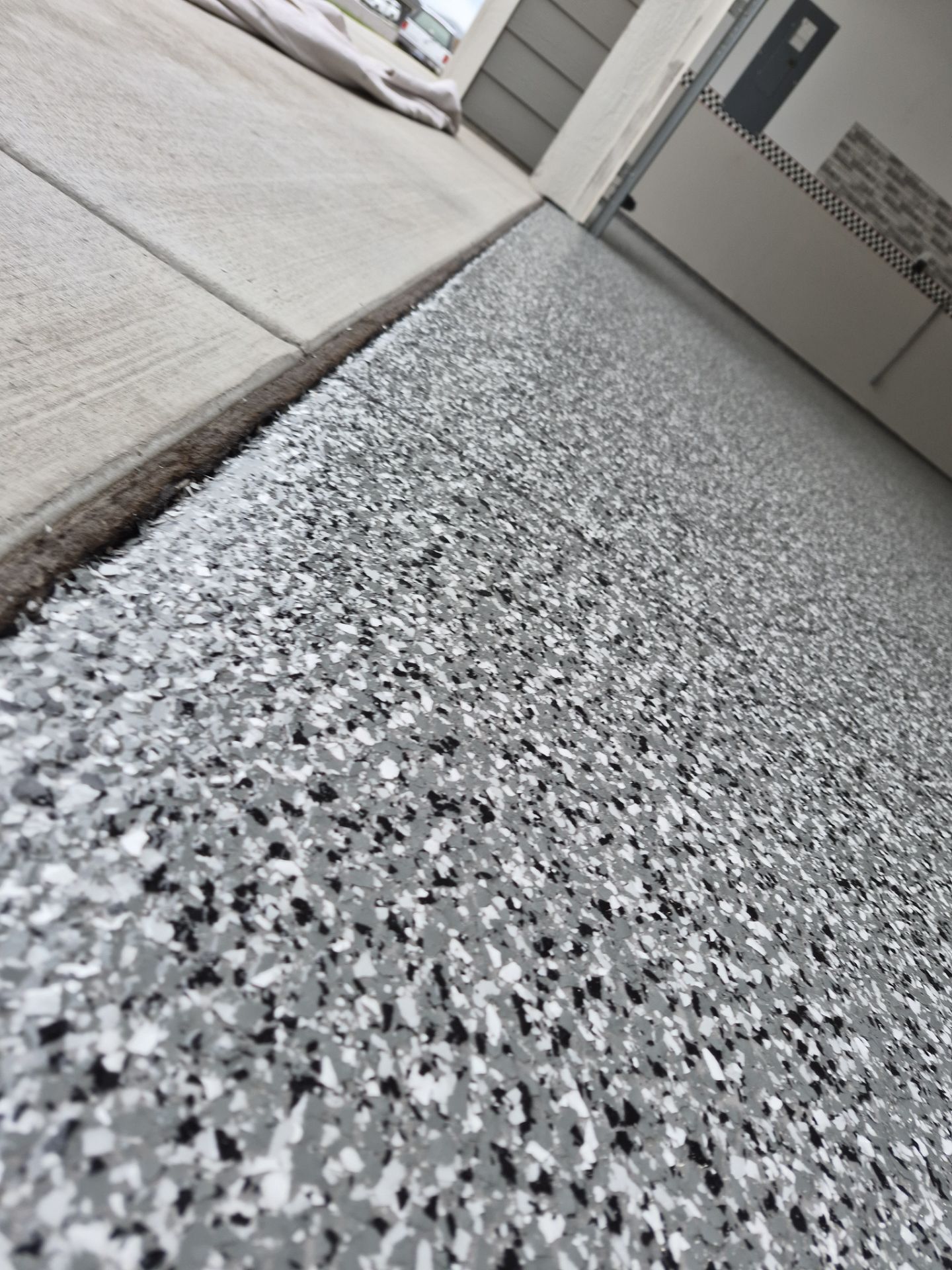 Full Garage Floor Transformation in Smoke 1/4" Flake Finish by Croc Coatings, LLC