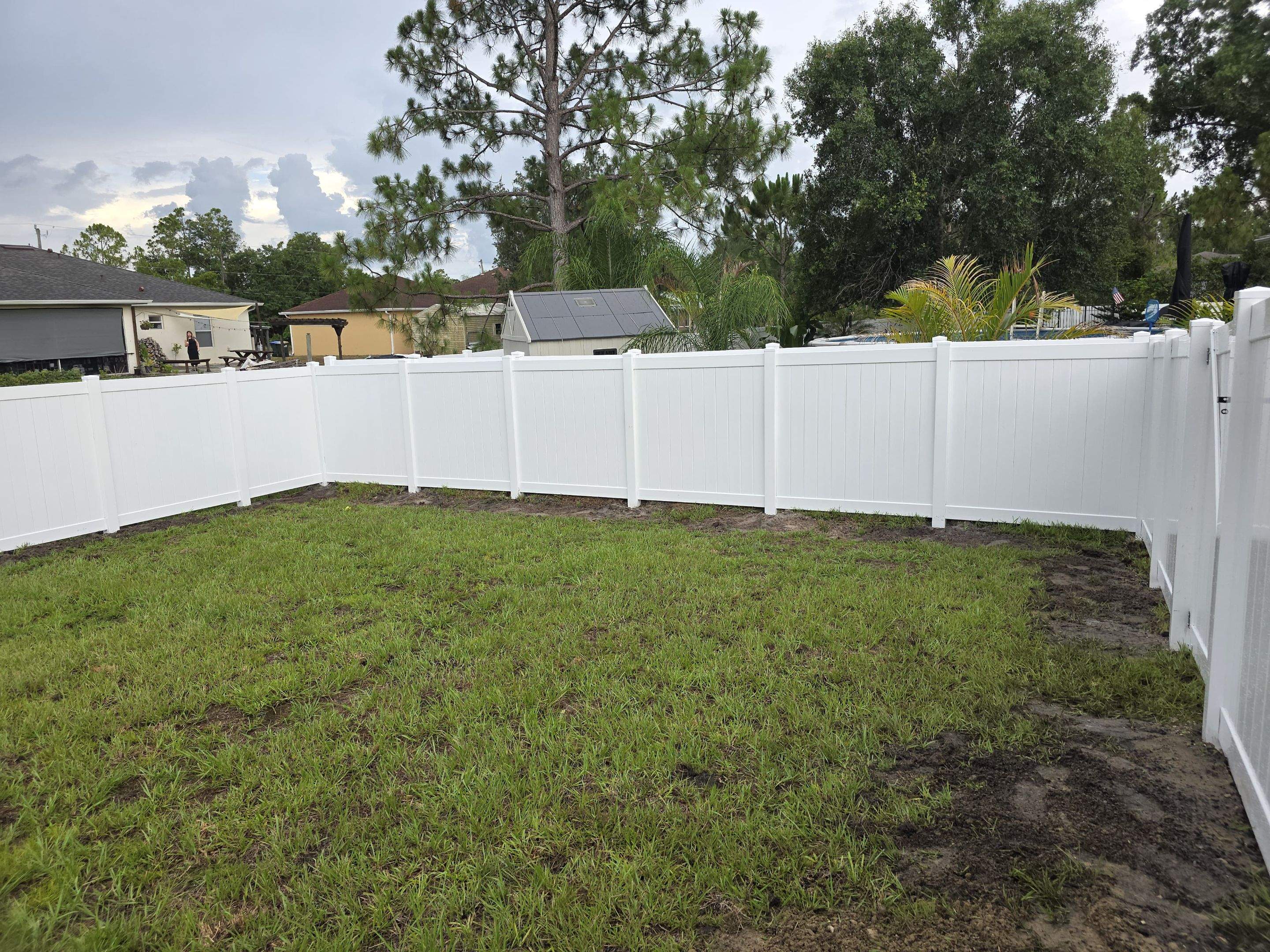 White Vinyl Privacy Fence with Gate Installation in North Port by True Fence LLC