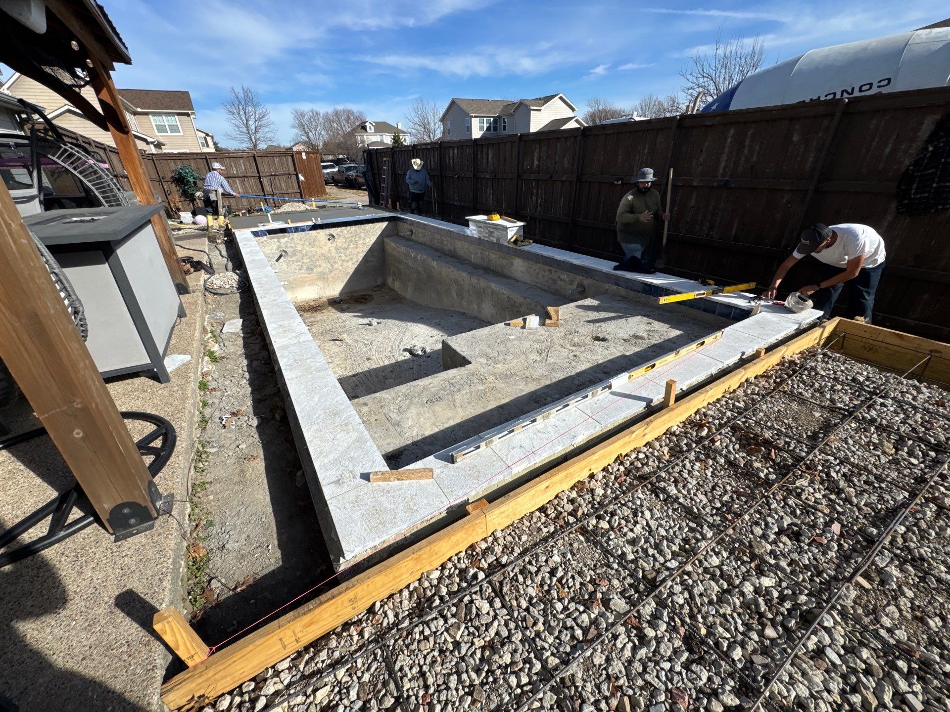 Pool with Turf and Raised Wall by Pinnacle Pools and Spas - DFW