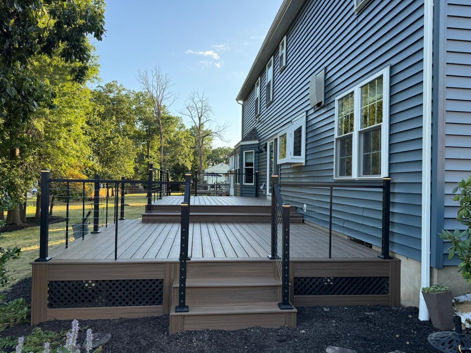 Deck resurface with Trex and cable rails by deck guardian