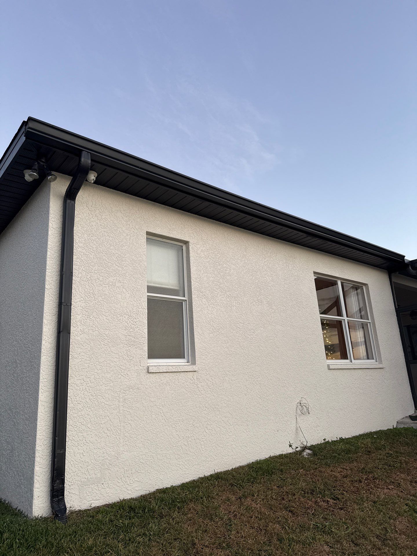 Black Aluminum Gutters with Matching Downspouts in Tampa FL by Gutter Professors