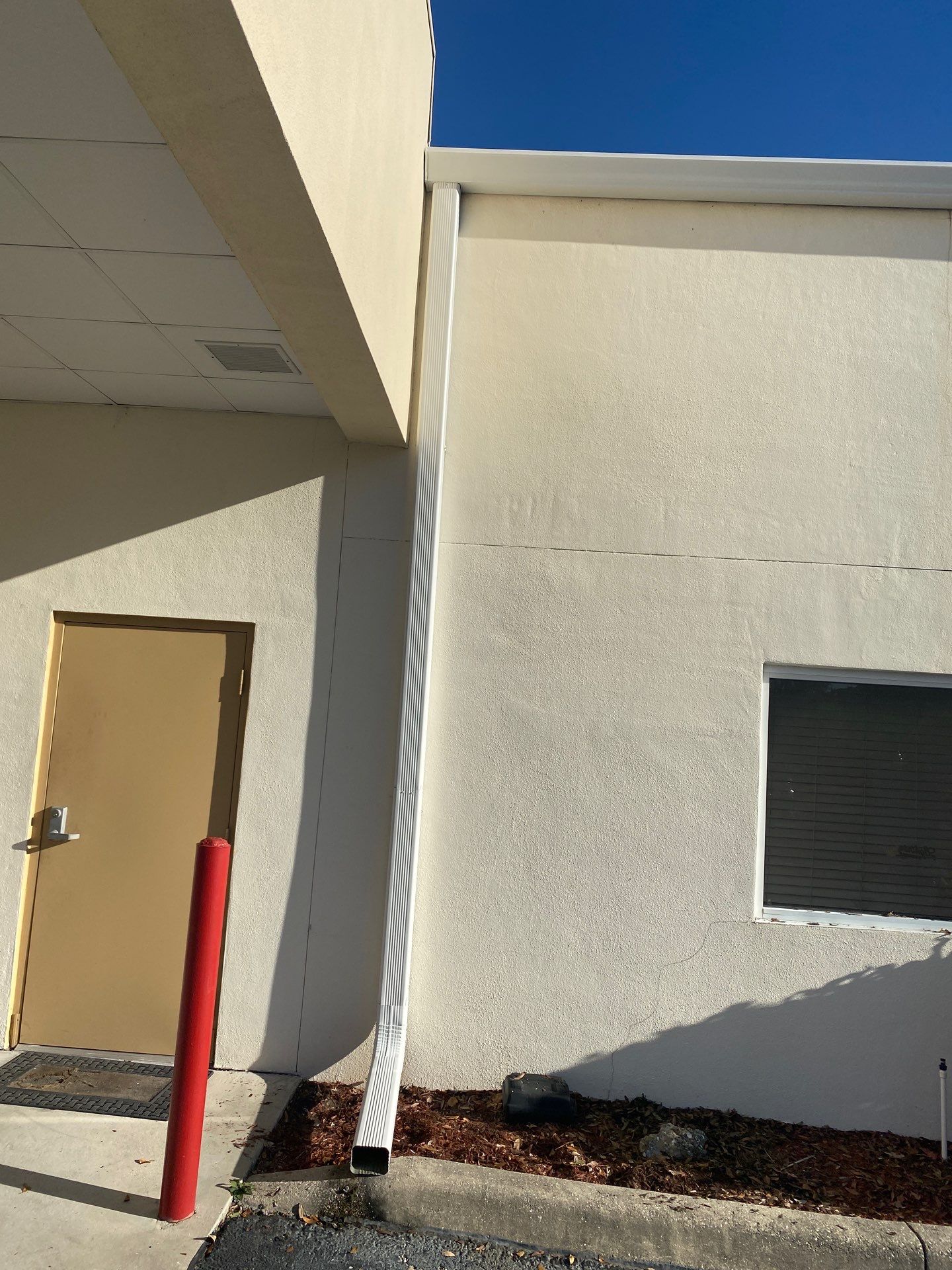 White 6-Inch Gutters with Downspouts in Bradenton FL by Gutter Professors