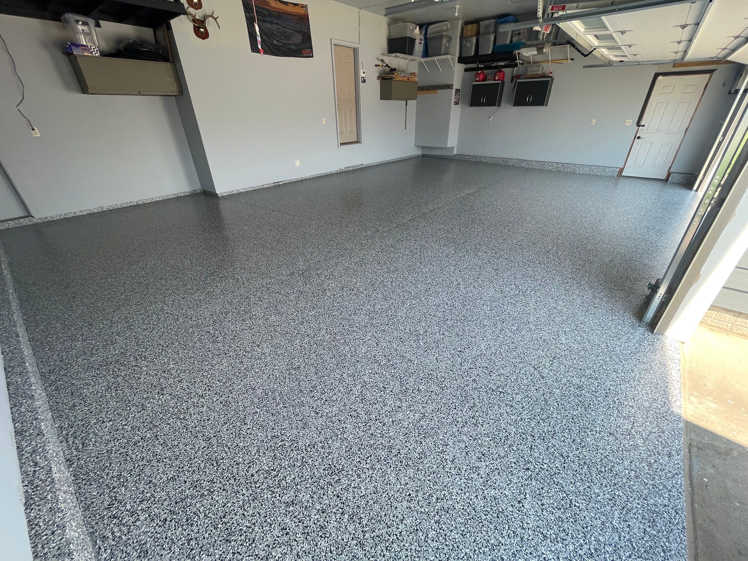 Sioux Falls Garage Concrete Coating Installation with Domino Flake by Select Painting, Coatings & Garage Cabinets