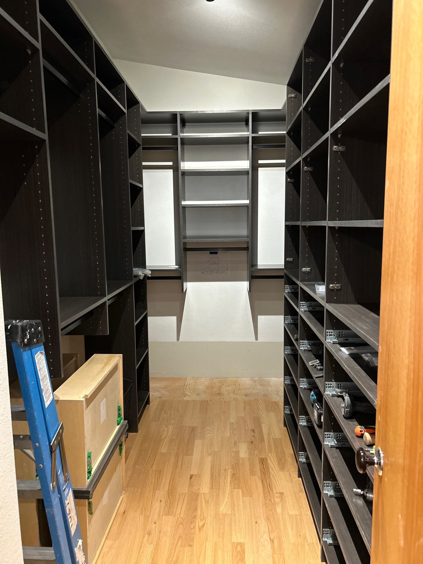 Black Riftwood Primary Closet in Centennial by Concept 32, Inc.