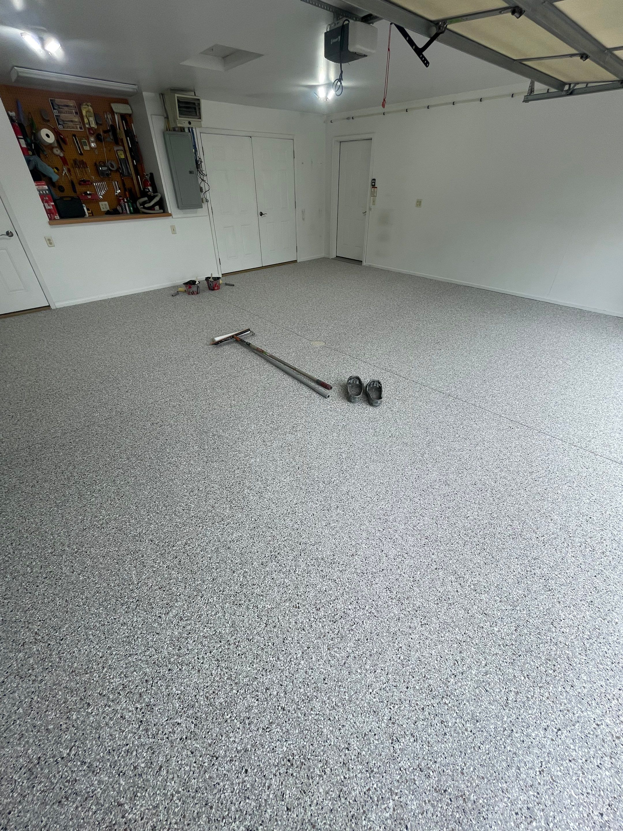 Coyote Flake Garage Floor Coating in Worthington, Minnesota by Select Painting, Coatings & Garage Cabinets