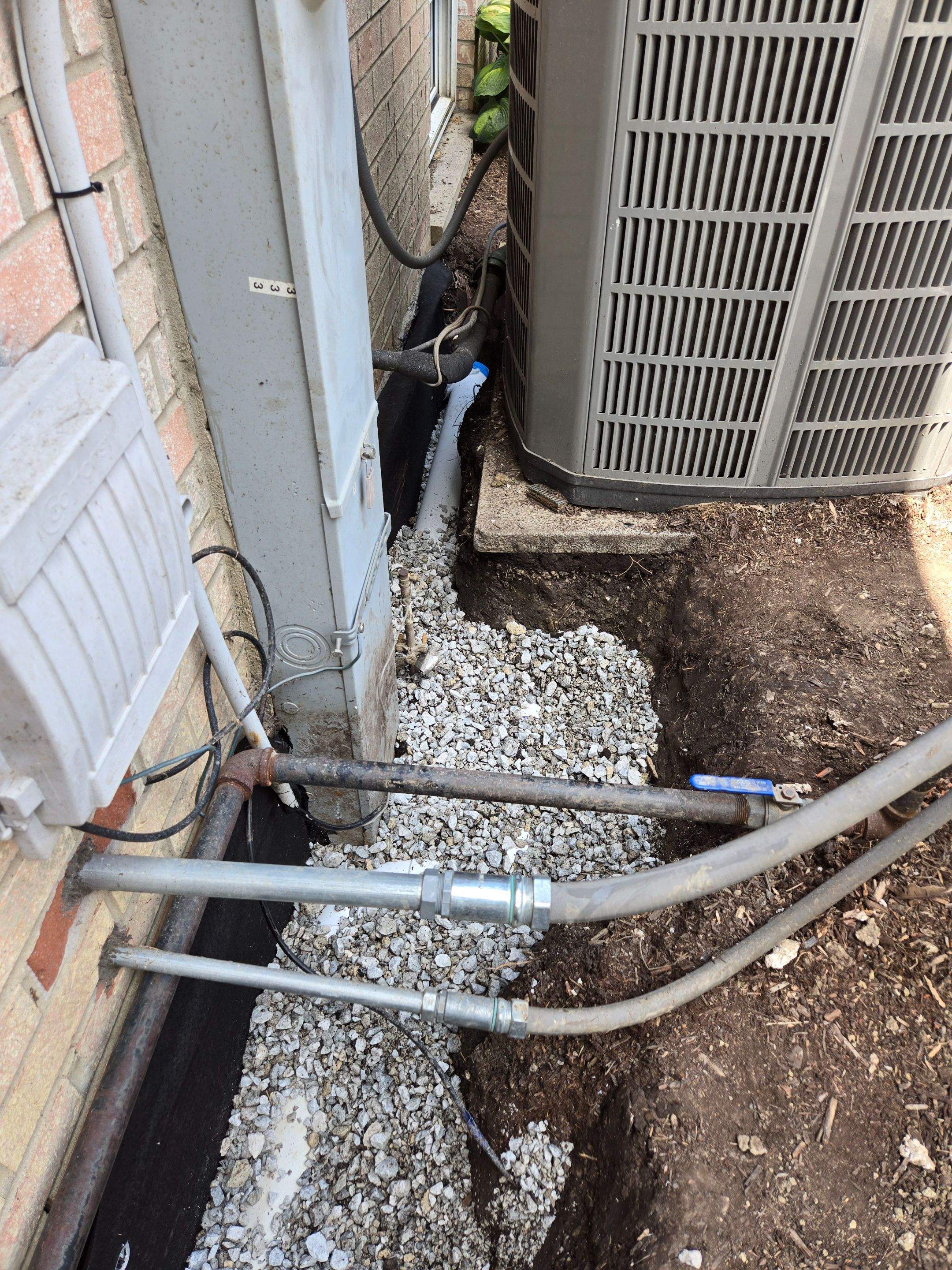Burial of Sump Pump and Down Spout Discharges and Partial Waterproofing of Wall by Allied Water Services