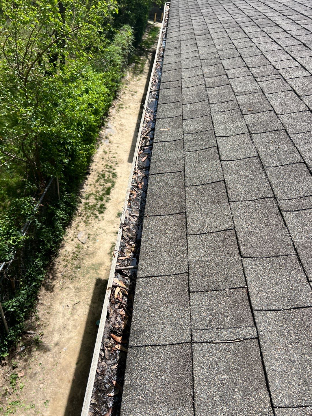 Commercial gutter cleaning Louisville, KY before photo with filled gutters