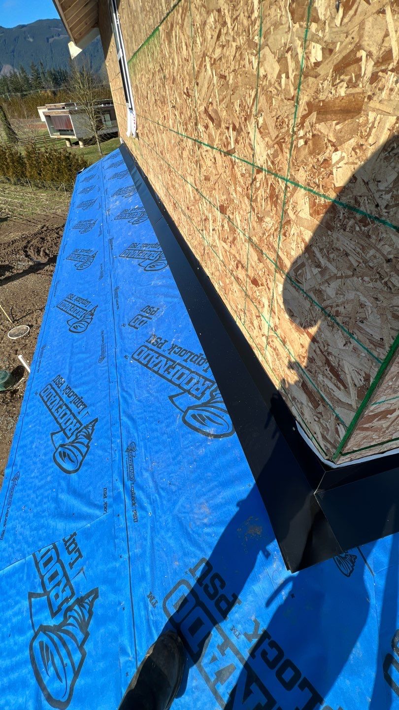 Residential Roofing Installation using 16" Prolok metal and Owens corning shingles by Top Notch Roofing Inc