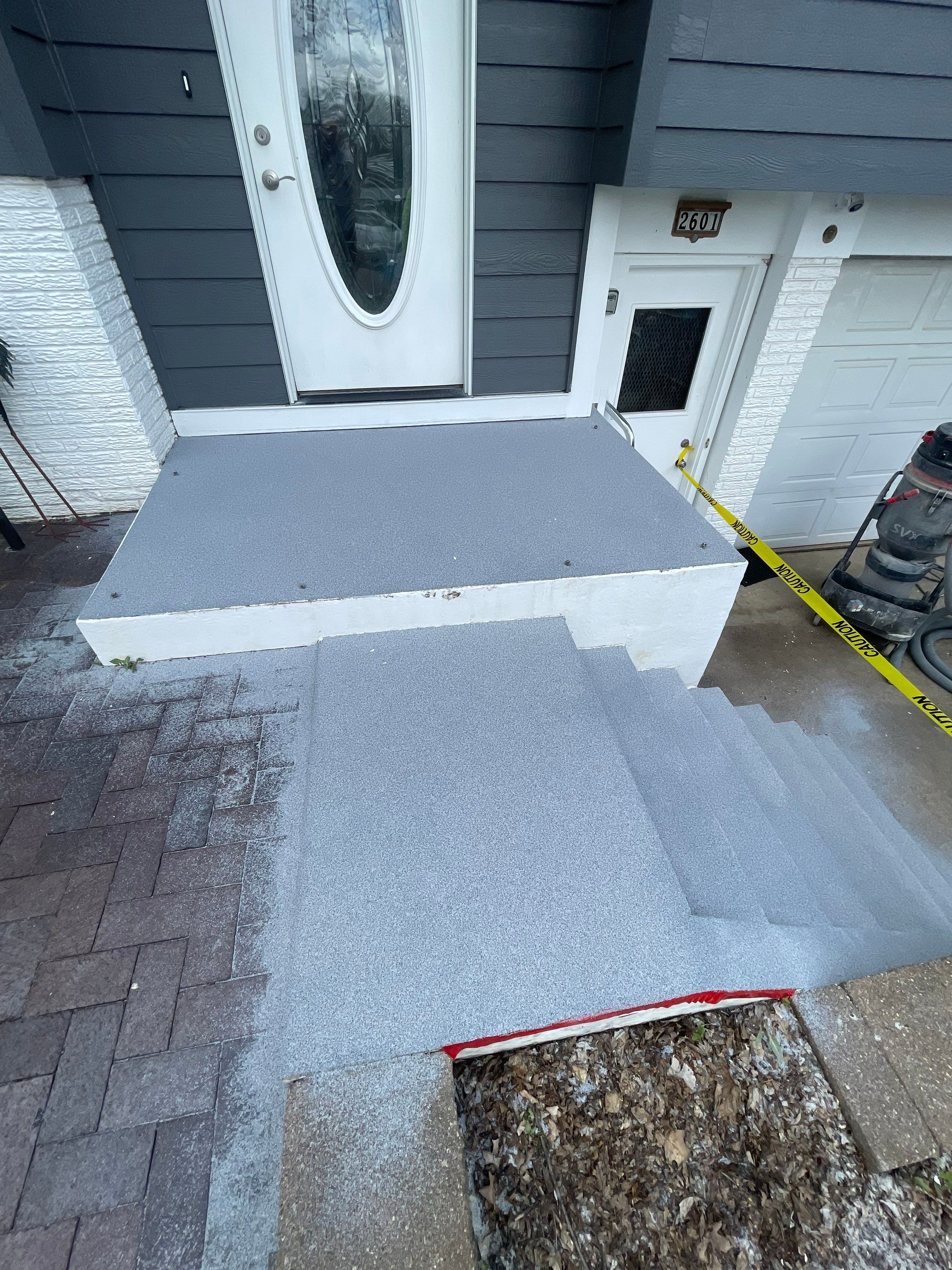 Grey Polyaspartic Porch and Stair Resurfacing in Sioux Falls by Select Painting, Coatings & Garage Cabinets