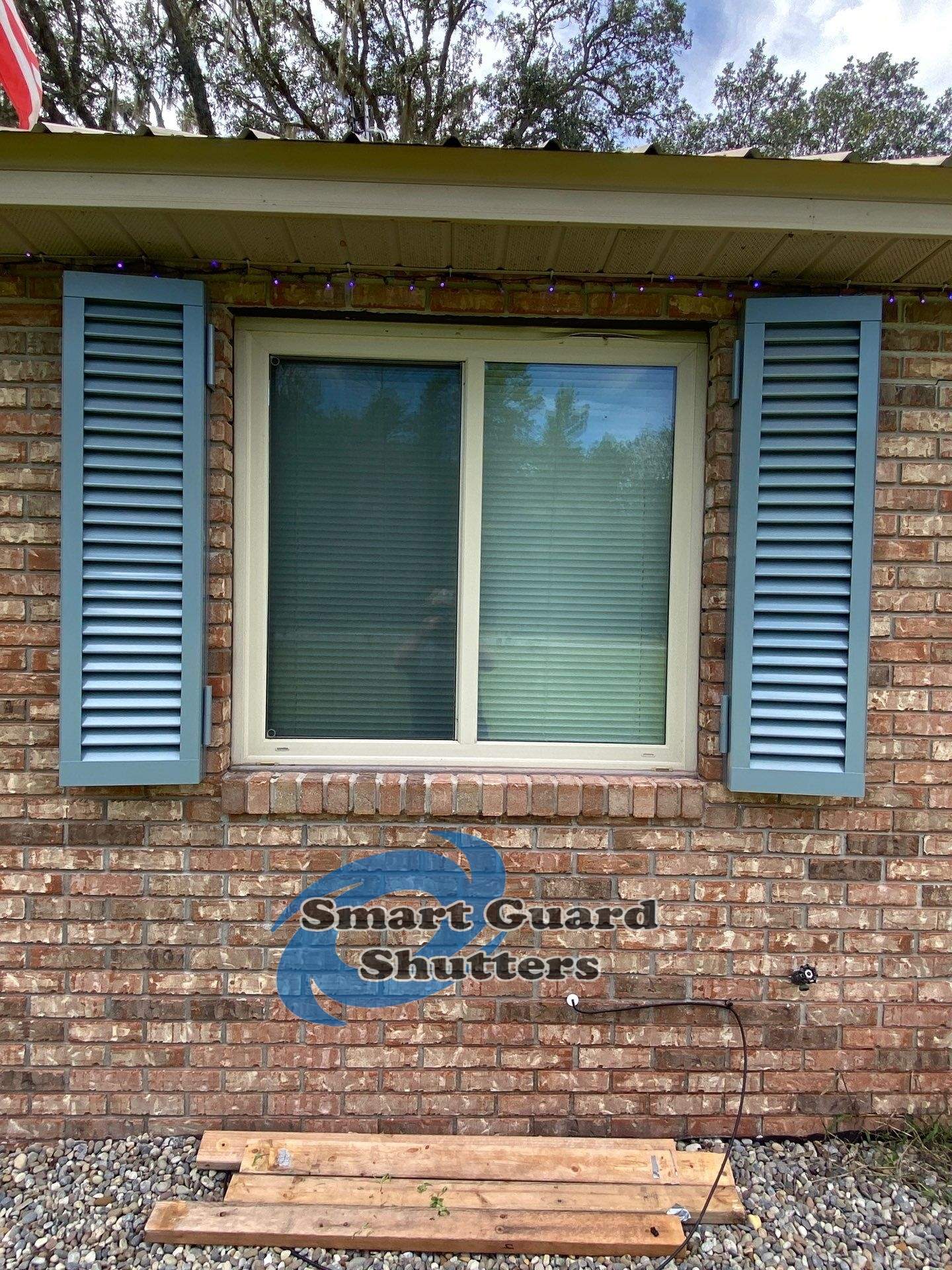 Impact Colonial Shutters in Squirrel Grey by Smart Guard Shutters