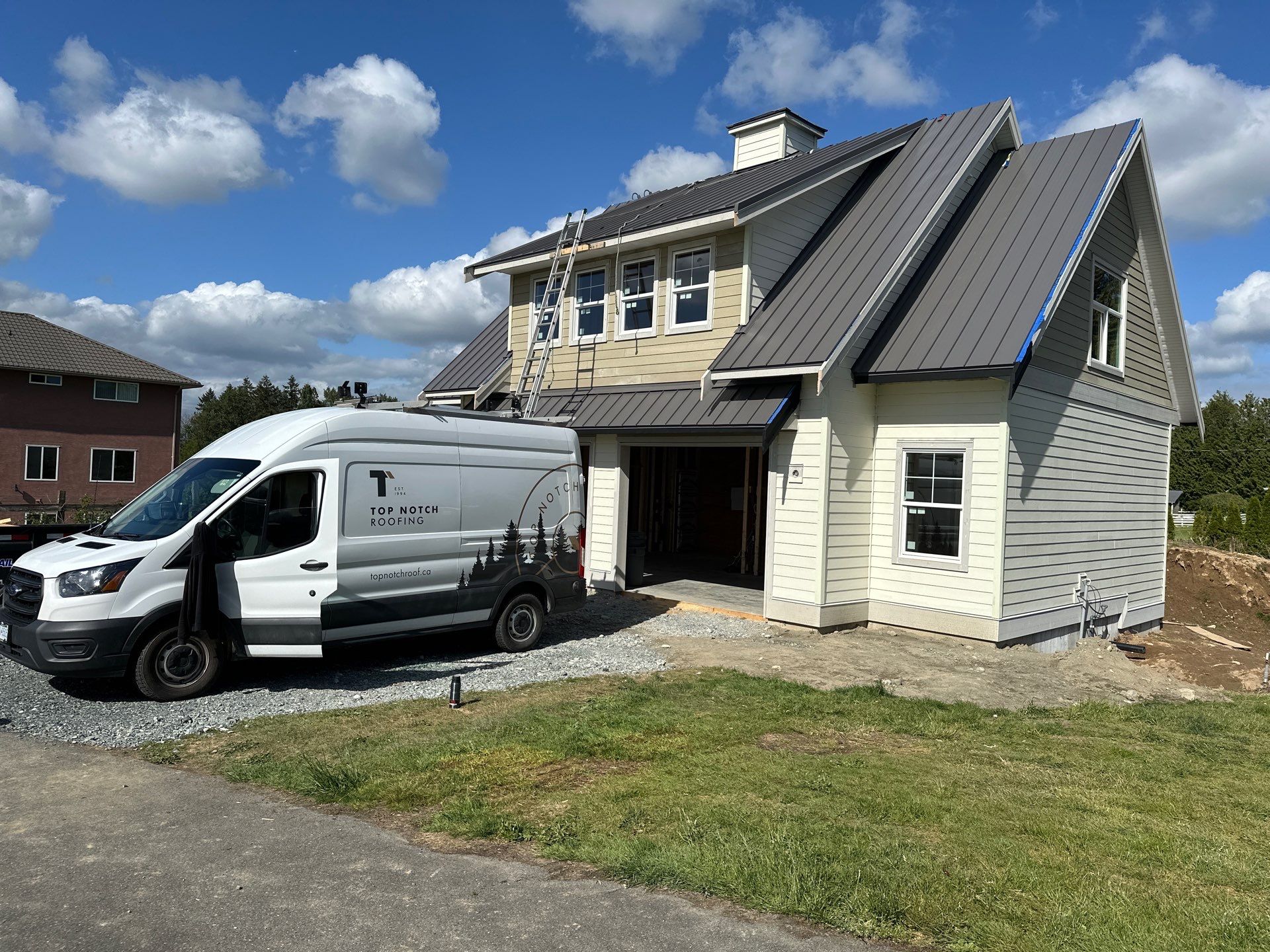 Residential Roofing Installation using 12" Prolok metal  by Top Notch Roofing Inc
