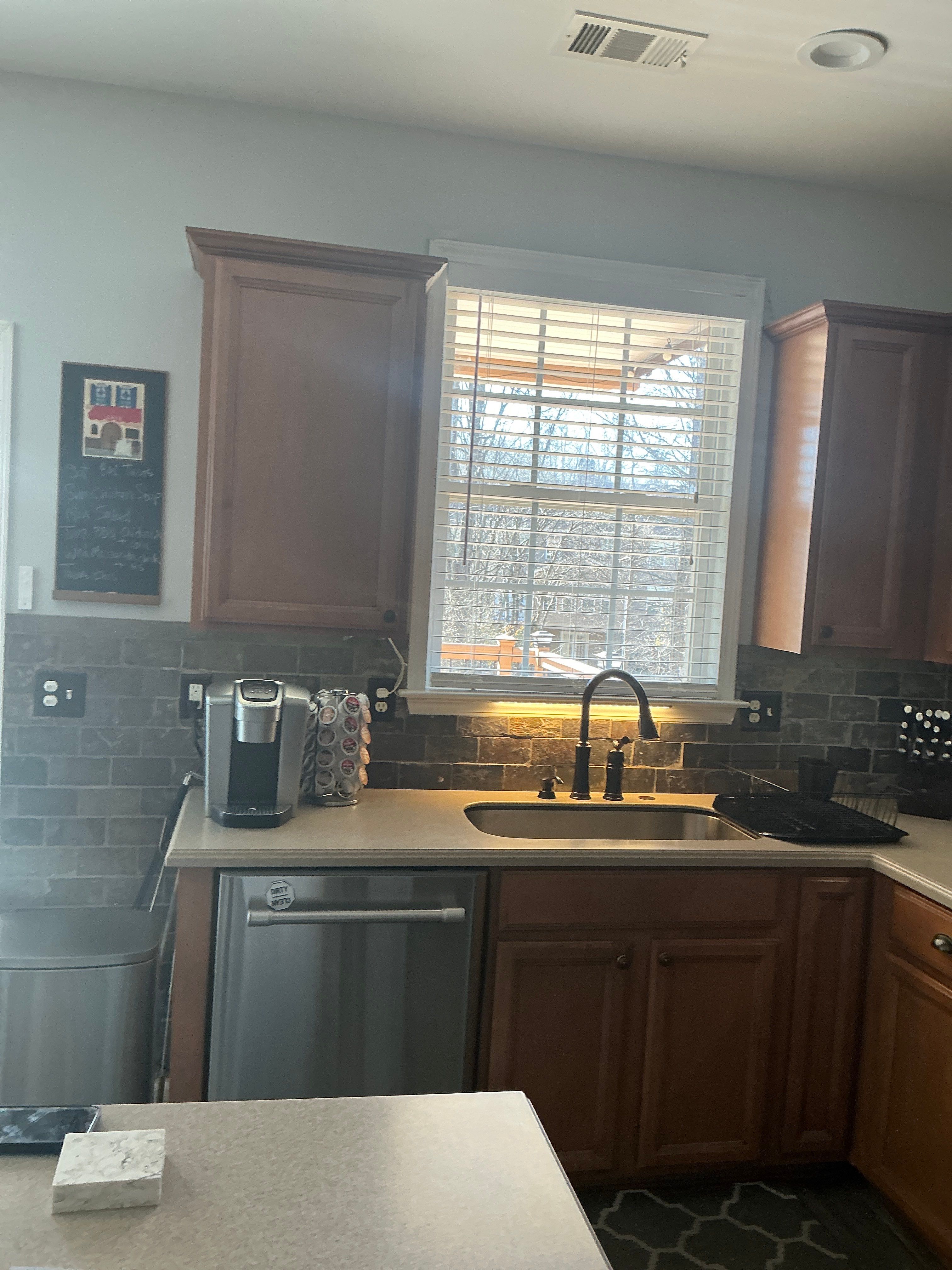 Modern Kitchen Remodel With Grey Shaker Cabinets and Navy Blue Island by Heart & Home Kitchen & Bath Remodeling LLC