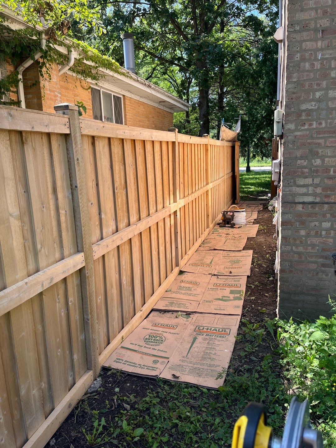 Wood fence cleaning and sealing by Northern Power Washing LLC.