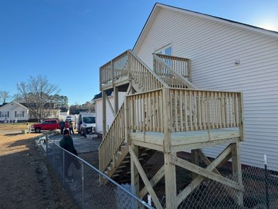 Elevated Pressure-Treated Wood Deck and Sliding Glass Door Installation in Clayton