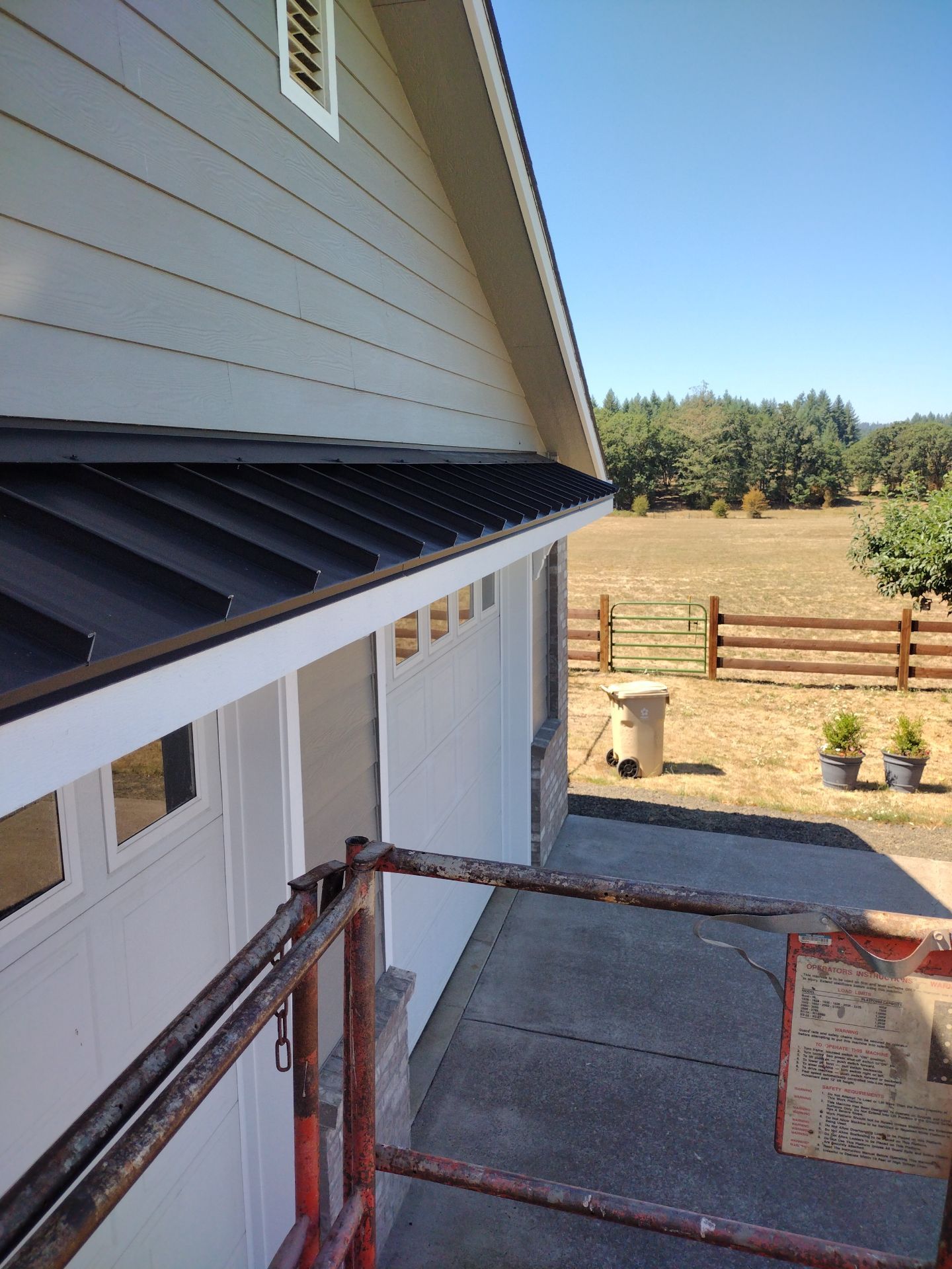 Residential Roof Replacement with Metal Accents by Orezona Building & Roofing Company, Inc.