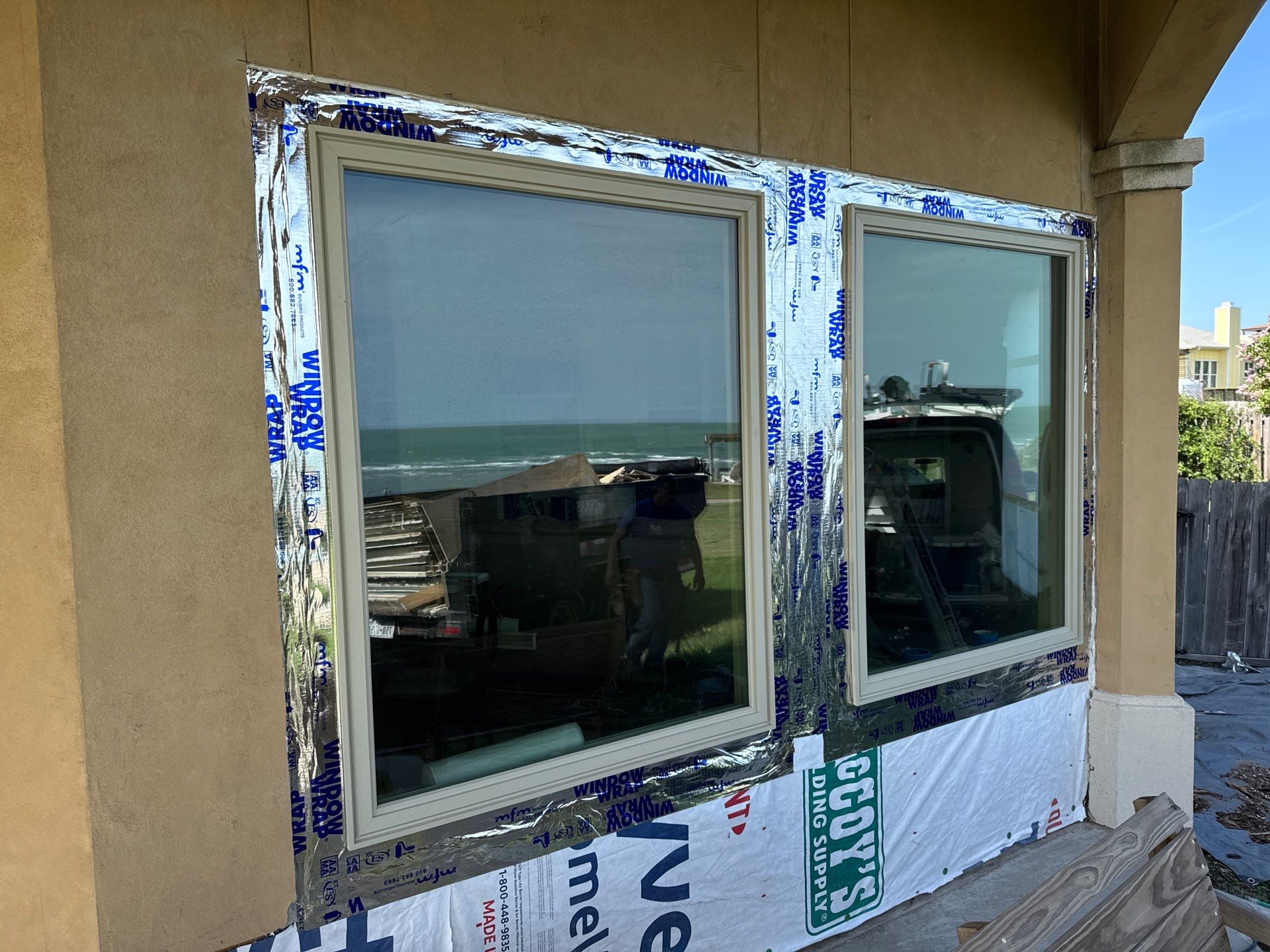 Installing Windows on a Submarine  by Bayfront Roofing and Construction